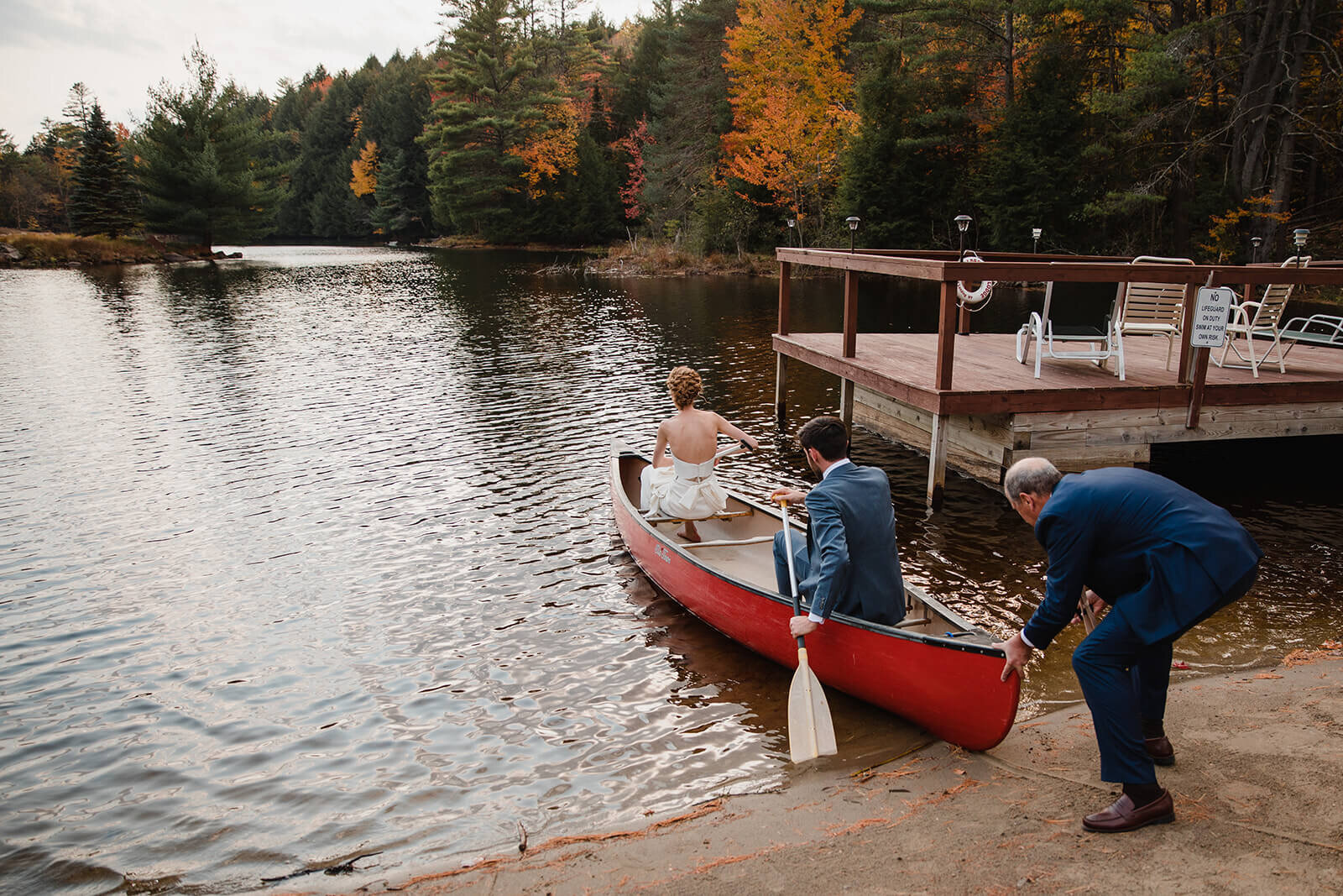  Bride and groom set out in a canoe to paddle to the island in the middle of this awesome private lake in Upstate NY in the Adirondacks. Canoeing elopement upstate NY. 