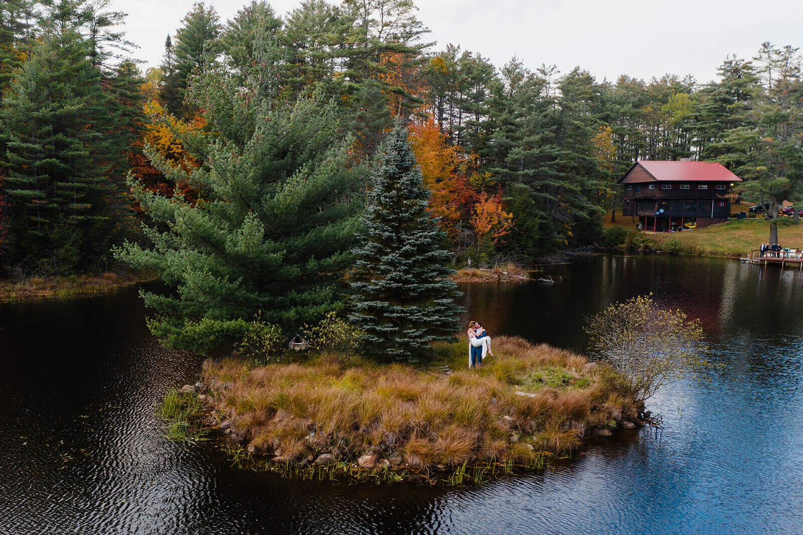  Bride and groom set out in a canoe to paddle to the island in the middle of this awesome private lake in Upstate NY in the Adirondacks. Canoeing elopement upstate NY. 