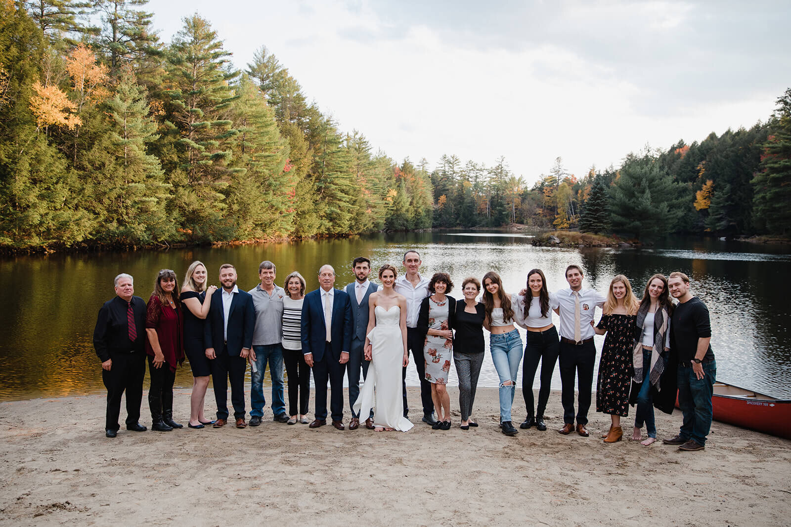  The whole crew celebrates the couple on the lake beach at Alderbrook Lodge in Upstate NY. 