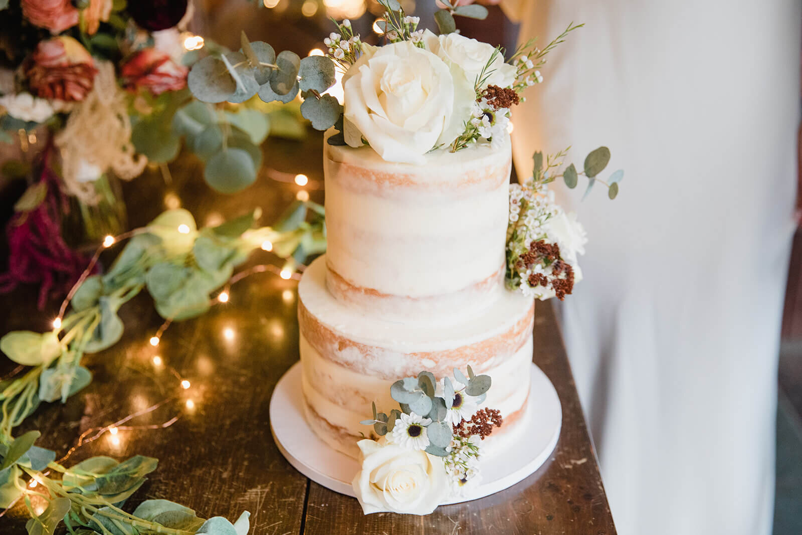  Couple cuts the cake and celebrates their wedding at Alderbrook Lodge in the Adirondacks Upstate NY. 