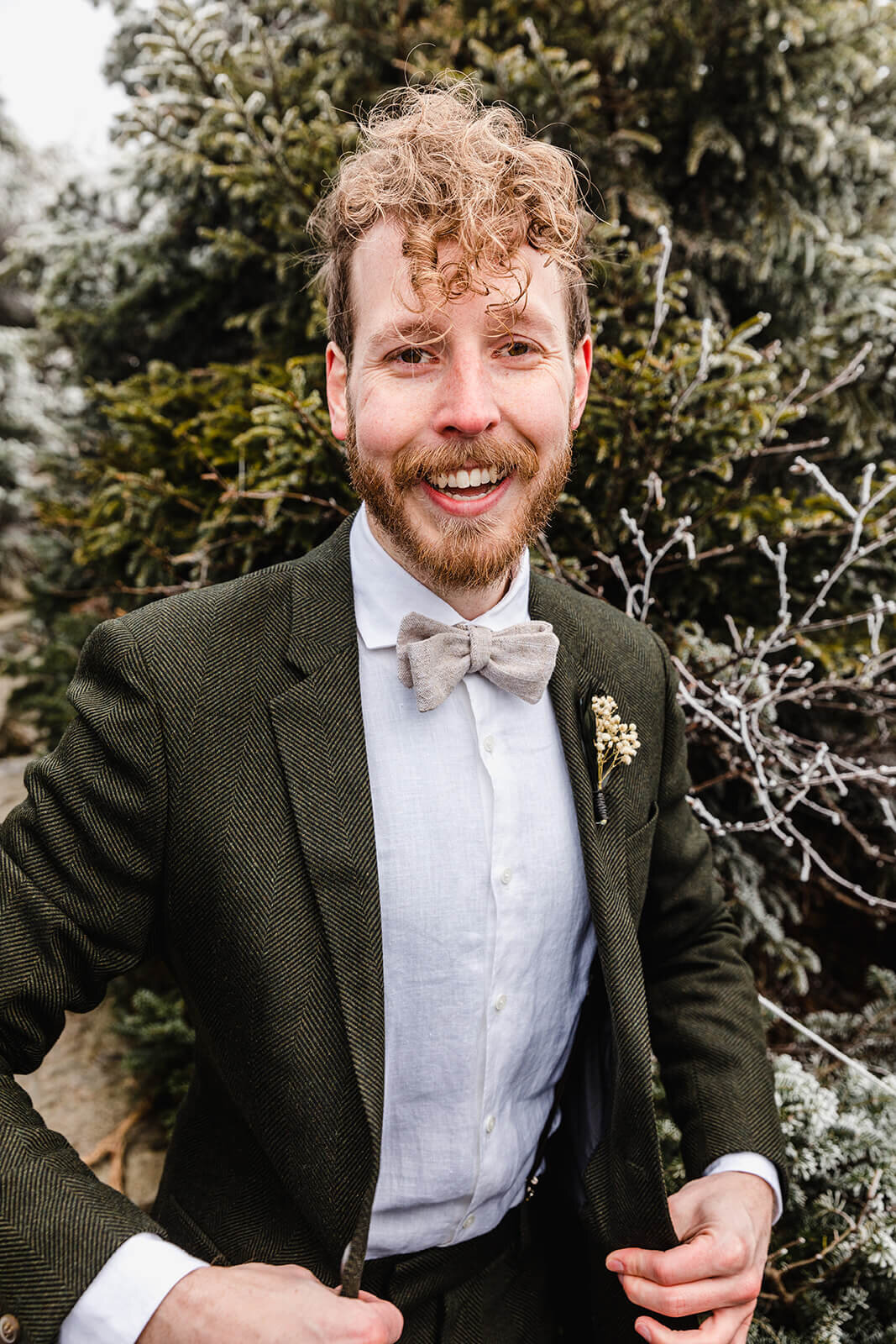  Eloping couple gets ready in frosty conditions during their adventure elopement on Mt. Mansfield, Vermont’s tallest mountain.  Vermont mountain wedding. Vermont winter elopement. Vermont elopement packages. 