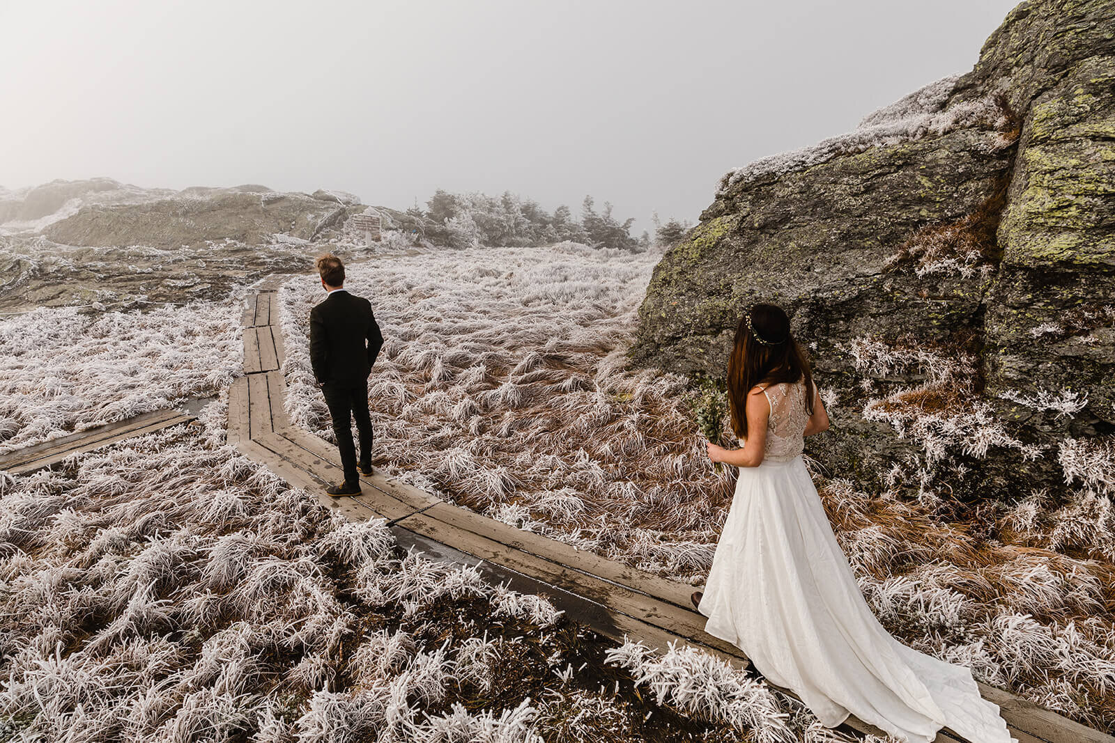  Eloping couple enjoys first look in frosty conditions during their adventure elopement on Mt. Mansfield, Vermont’s tallest mountain.  Vermont mountain wedding. Vermont winter elopement. Vermont elopement packages. 