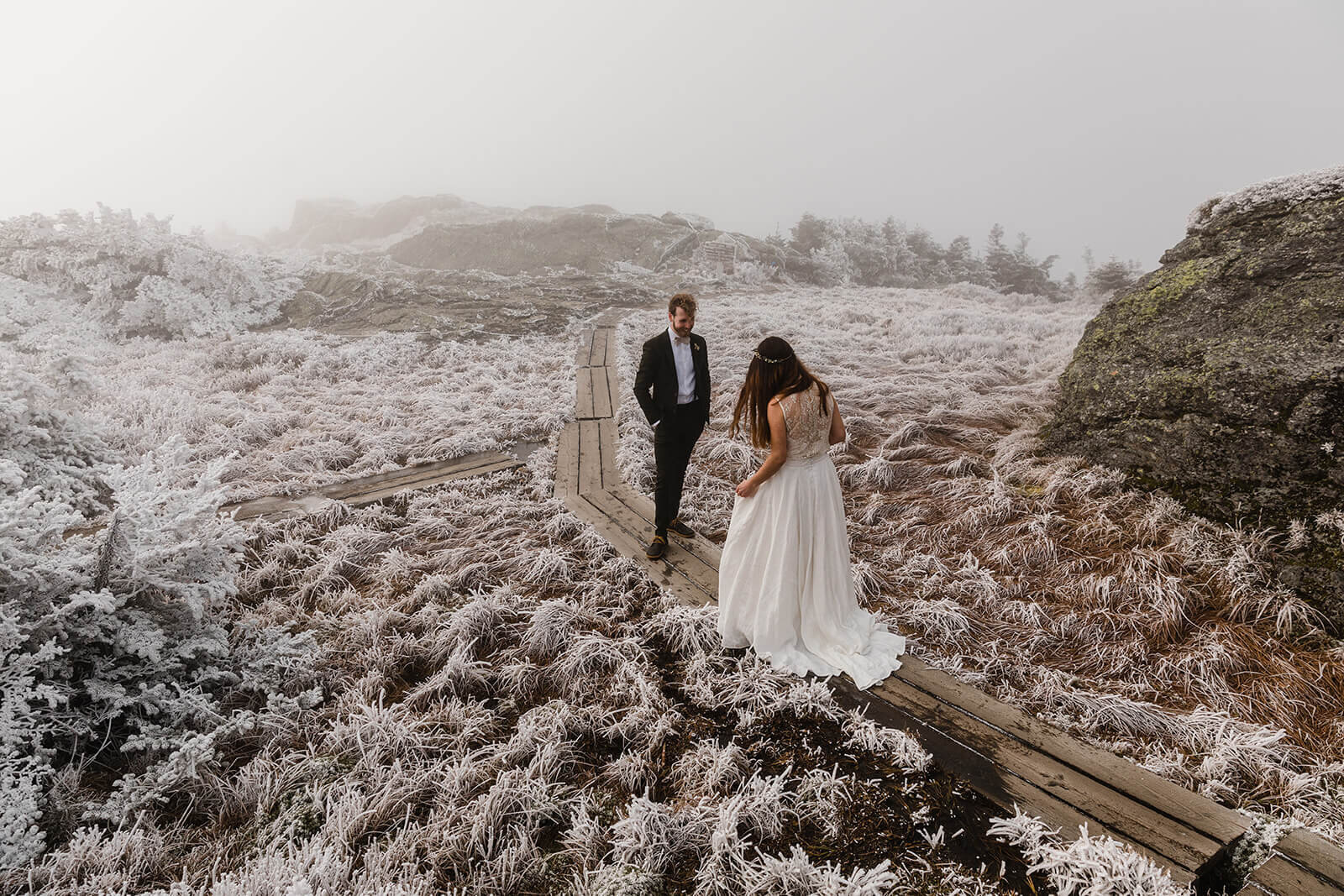  Eloping couple enjoys first look in frosty conditions during their adventure elopement on Mt. Mansfield, Vermont’s tallest mountain.  Vermont mountain wedding. Vermont winter elopement. Vermont elopement packages. 