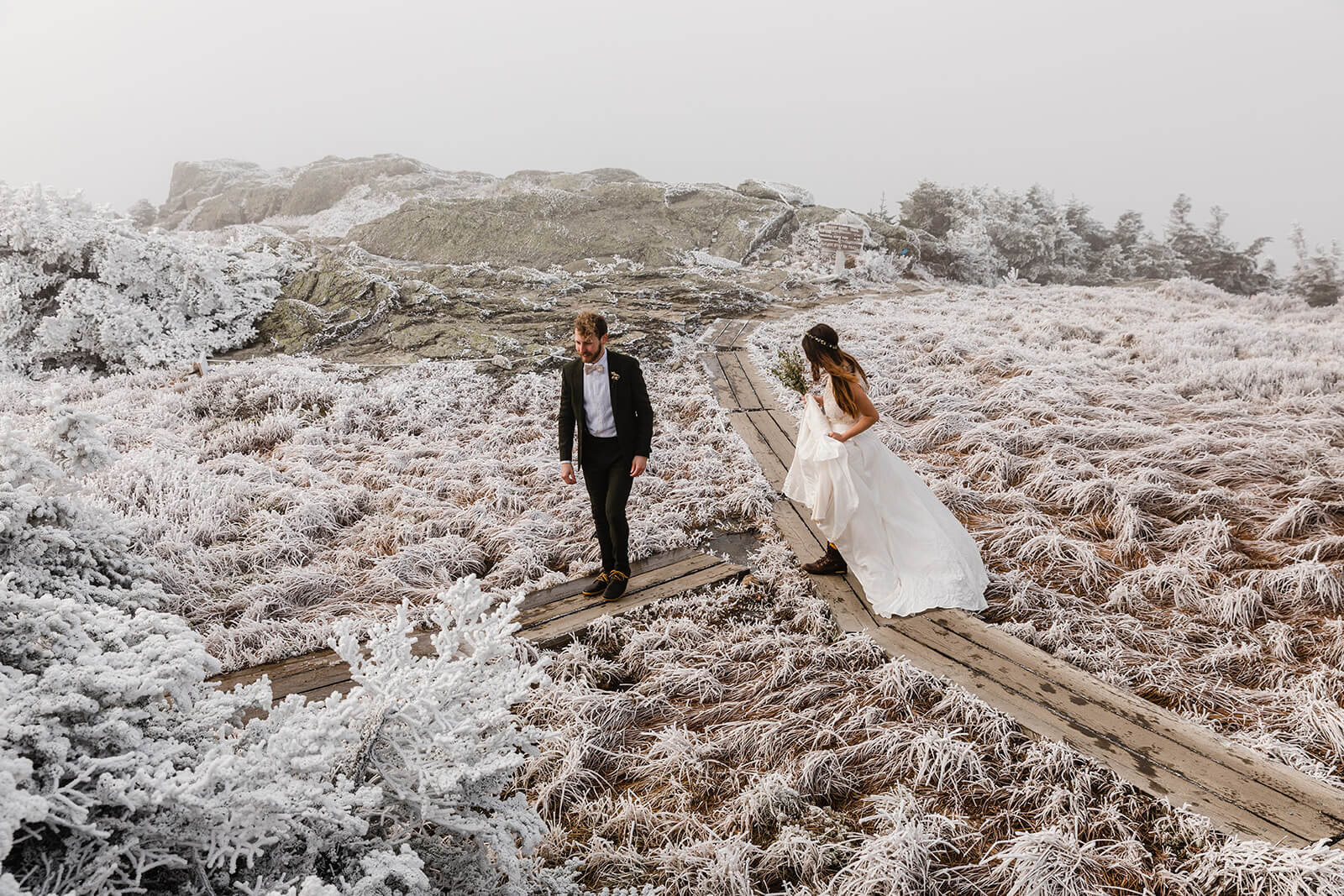  Eloping couple enjoys first look in frosty conditions during their adventure elopement on Mt. Mansfield, Vermont’s tallest mountain.  Vermont mountain wedding. Vermont winter elopement. Vermont elopement packages. 