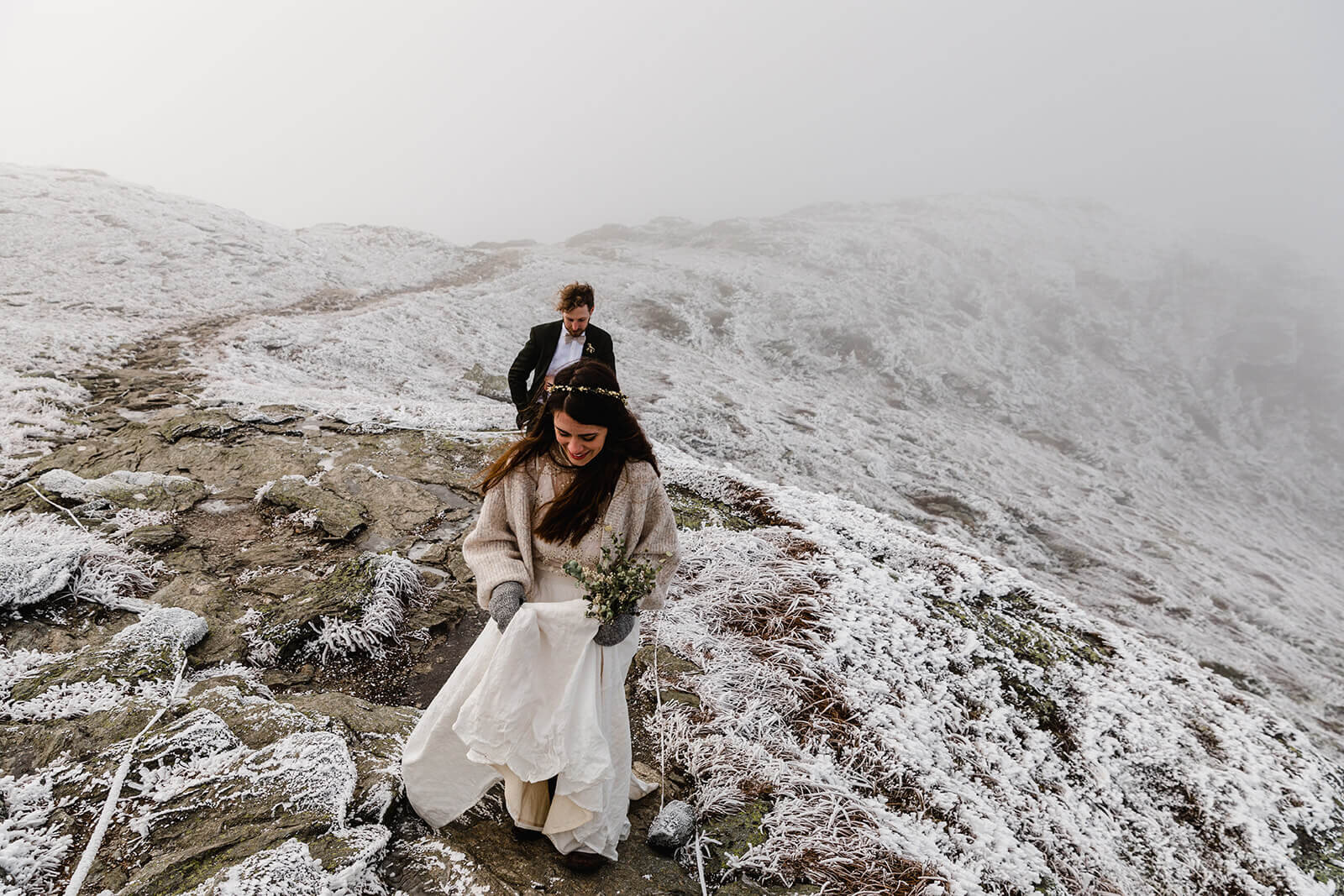  Eloping couple enjoys first look in frosty conditions during their adventure elopement on Mt. Mansfield, Vermont’s tallest mountain.  Vermont mountain wedding. Vermont winter elopement. Vermont elopement packages. 