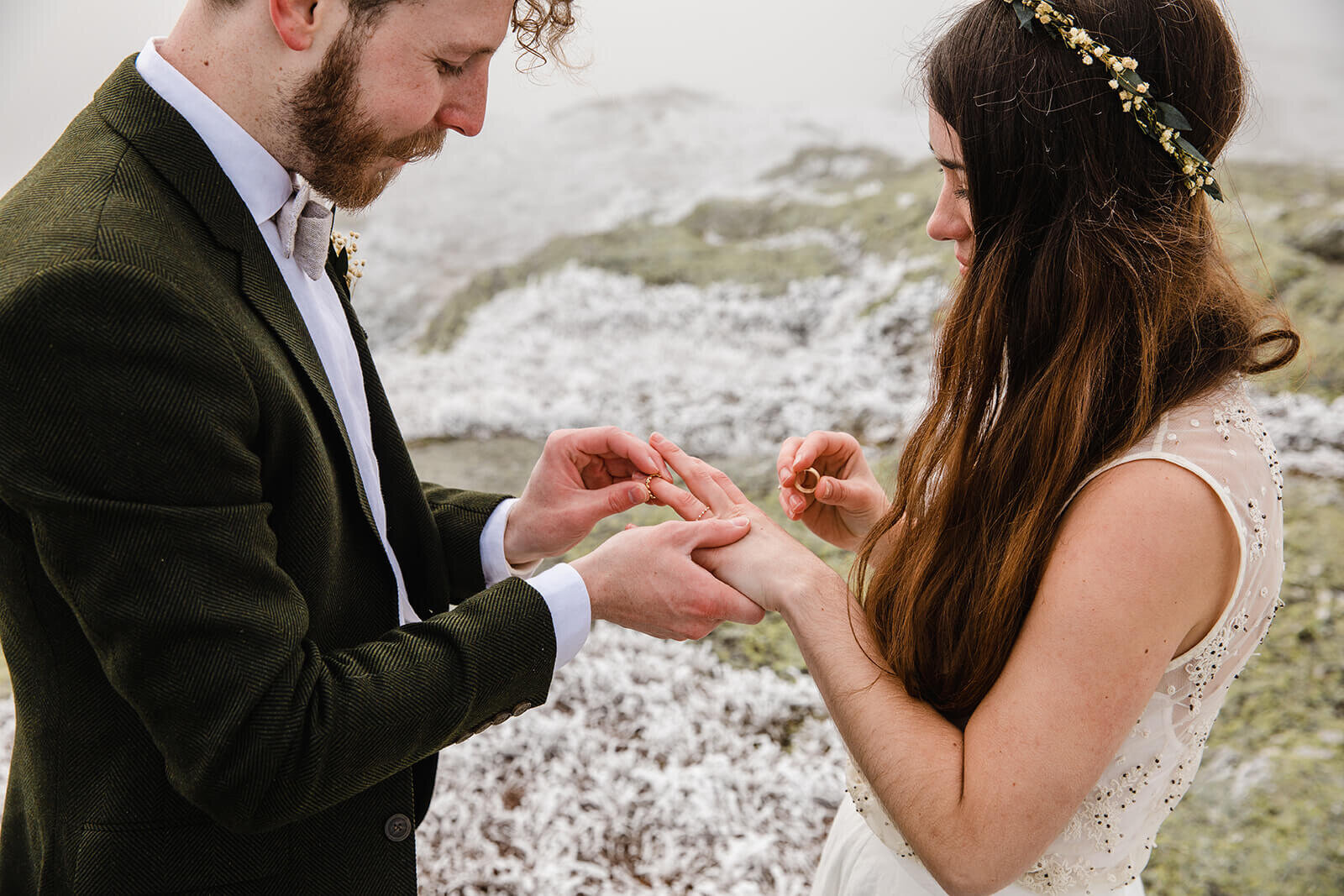  Eloping couple exchanges rings in frosty conditions during their adventure elopement on Mt. Mansfield, Vermont’s tallest mountain.  Vermont mountain wedding. Vermont winter elopement. Vermont elopement packages. 