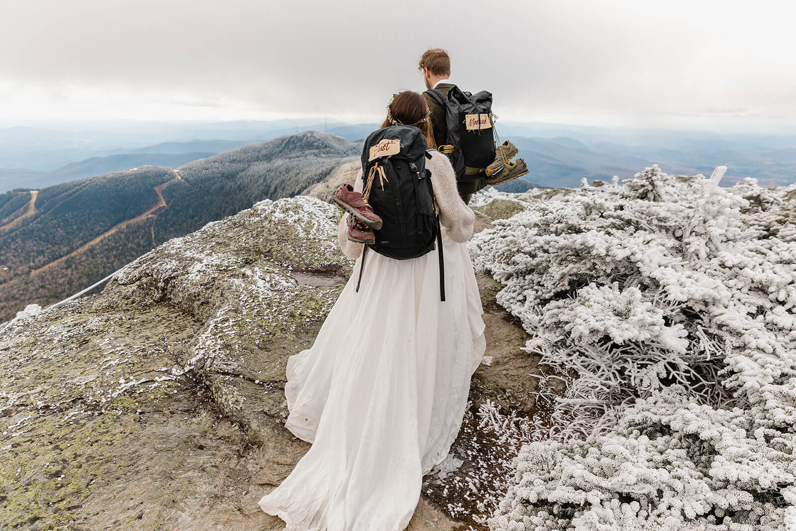  Eloping couple explores summit during their adventure elopement on Mt. Mansfield, Vermont’s tallest mountain.  Vermont mountain wedding. Vermont winter elopement. Vermont elopement packages. 