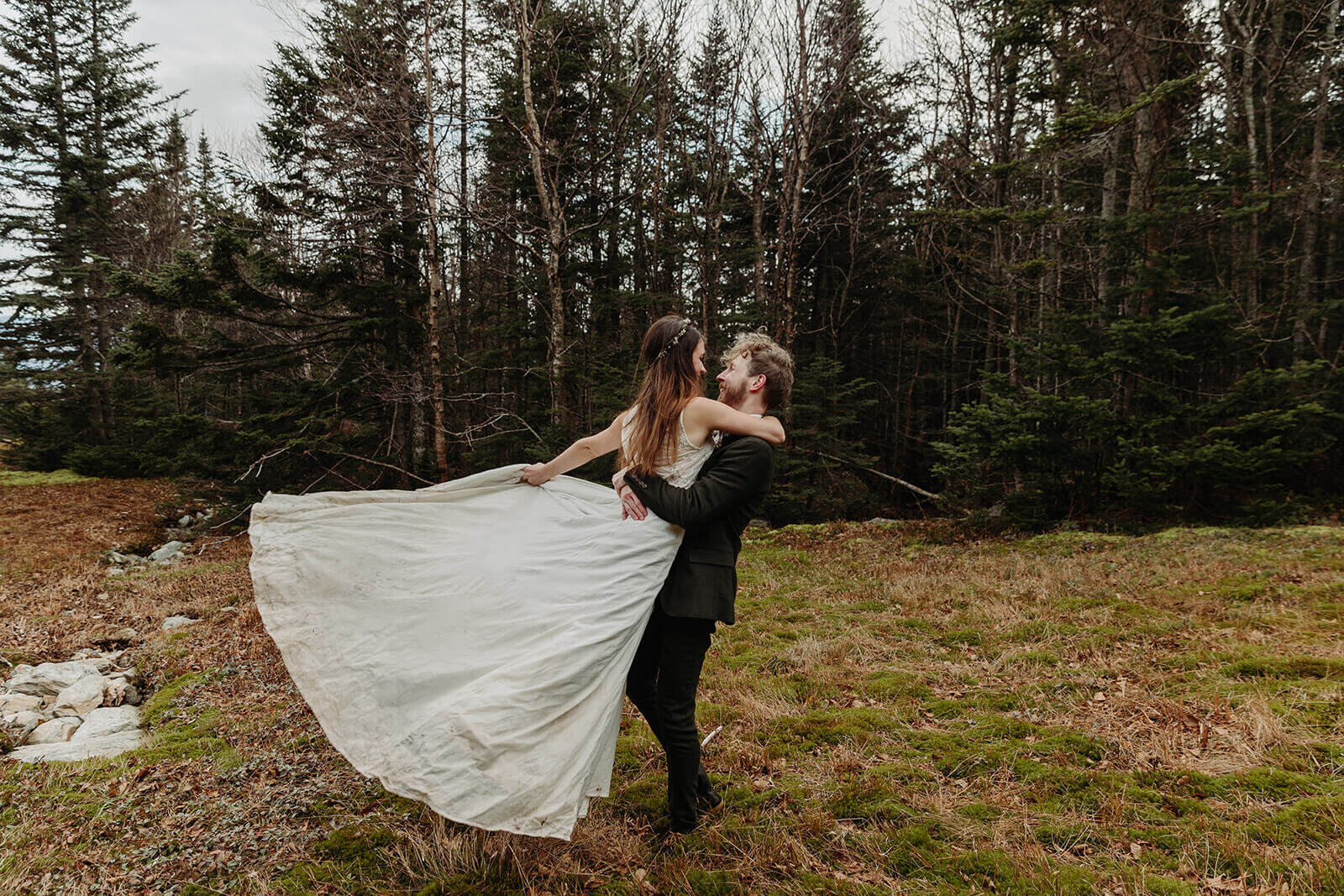  Eloping couple explores trail during their adventure elopement on Mt. Mansfield, Vermont’s tallest mountain.  Vermont mountain wedding. Vermont winter elopement. Vermont elopement packages. 