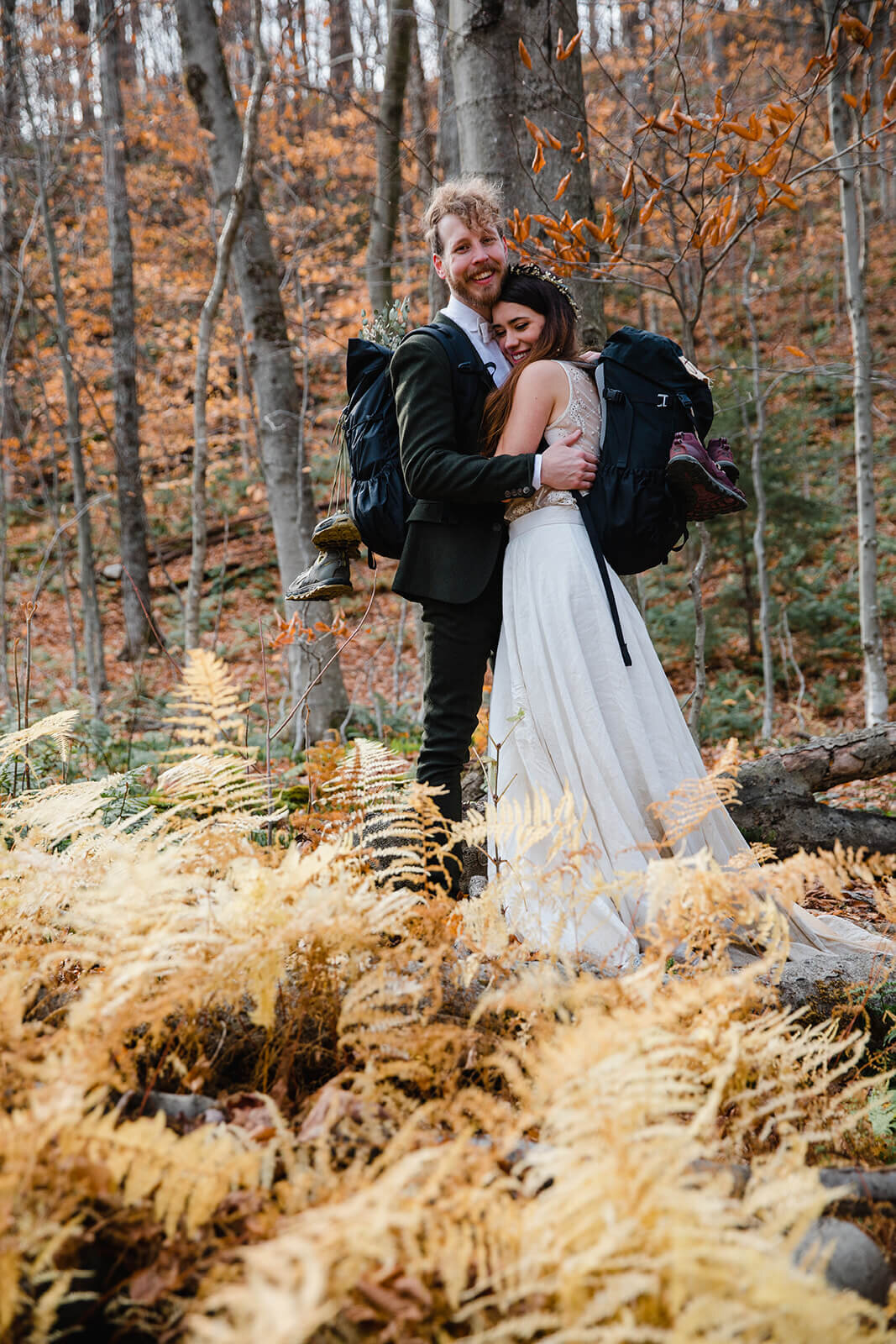  Eloping couple explores trail during their adventure elopement on Mt. Mansfield, Vermont’s tallest mountain.  Vermont mountain wedding. Vermont winter elopement. Vermont elopement packages. 