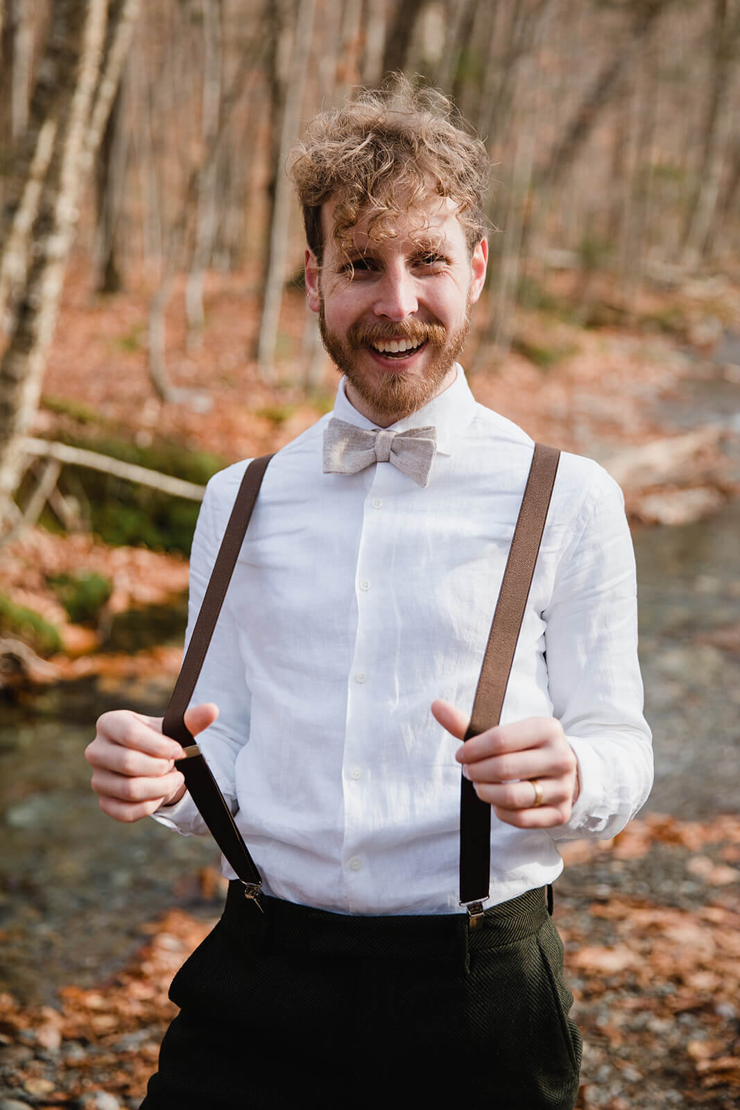  Eloping couple explores trail during their adventure elopement on Mt. Mansfield, Vermont’s tallest mountain.  Vermont mountain wedding. Vermont winter elopement. Vermont elopement packages. 