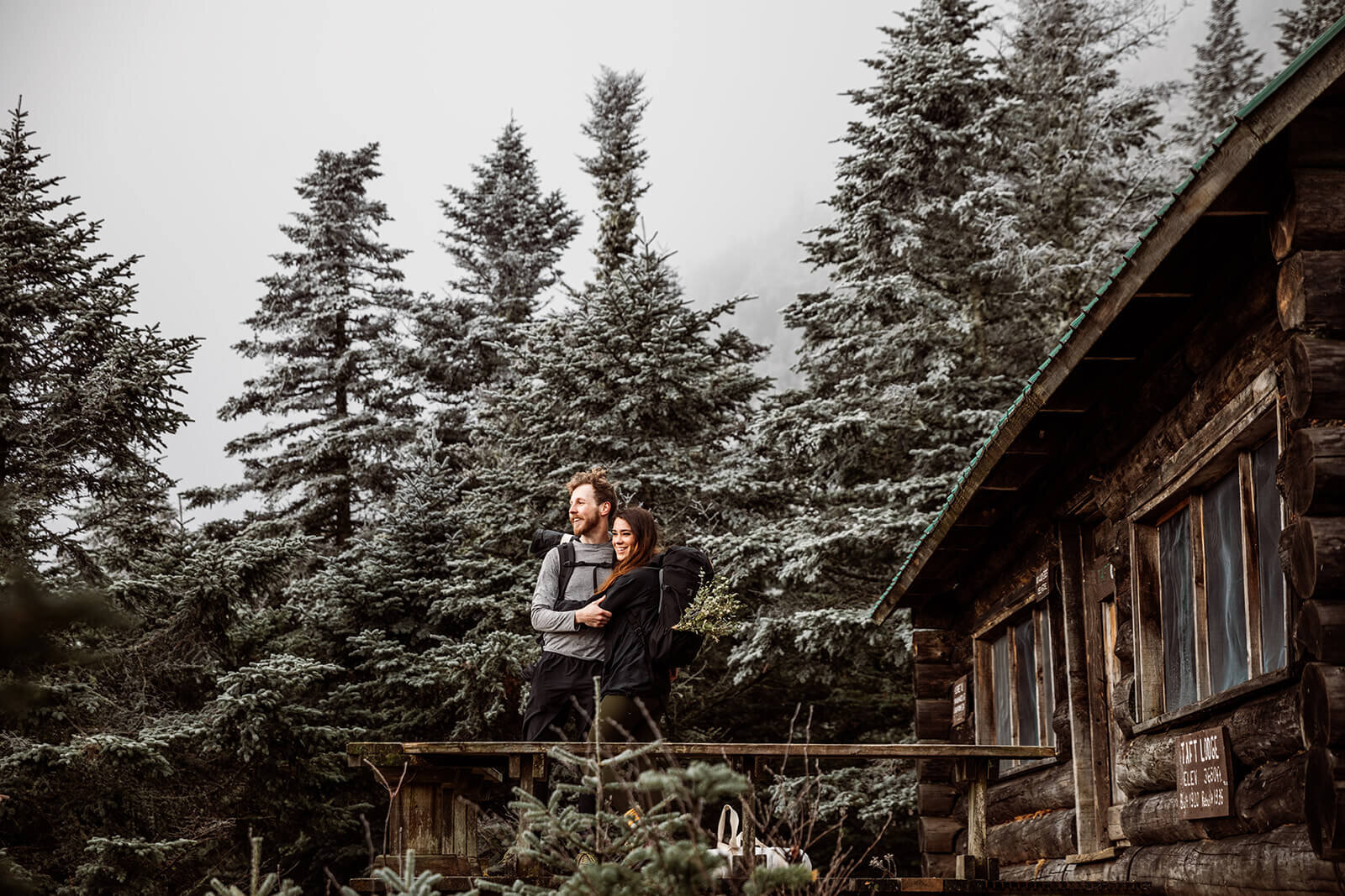  Eloping couple stops at a lodge that is part of the Long Trail during their adventure elopement on Mt. Mansfield, Vermont’s tallest mountain.  Vermont mountain wedding. Vermont winter elopement. Vermont elopement packages. 