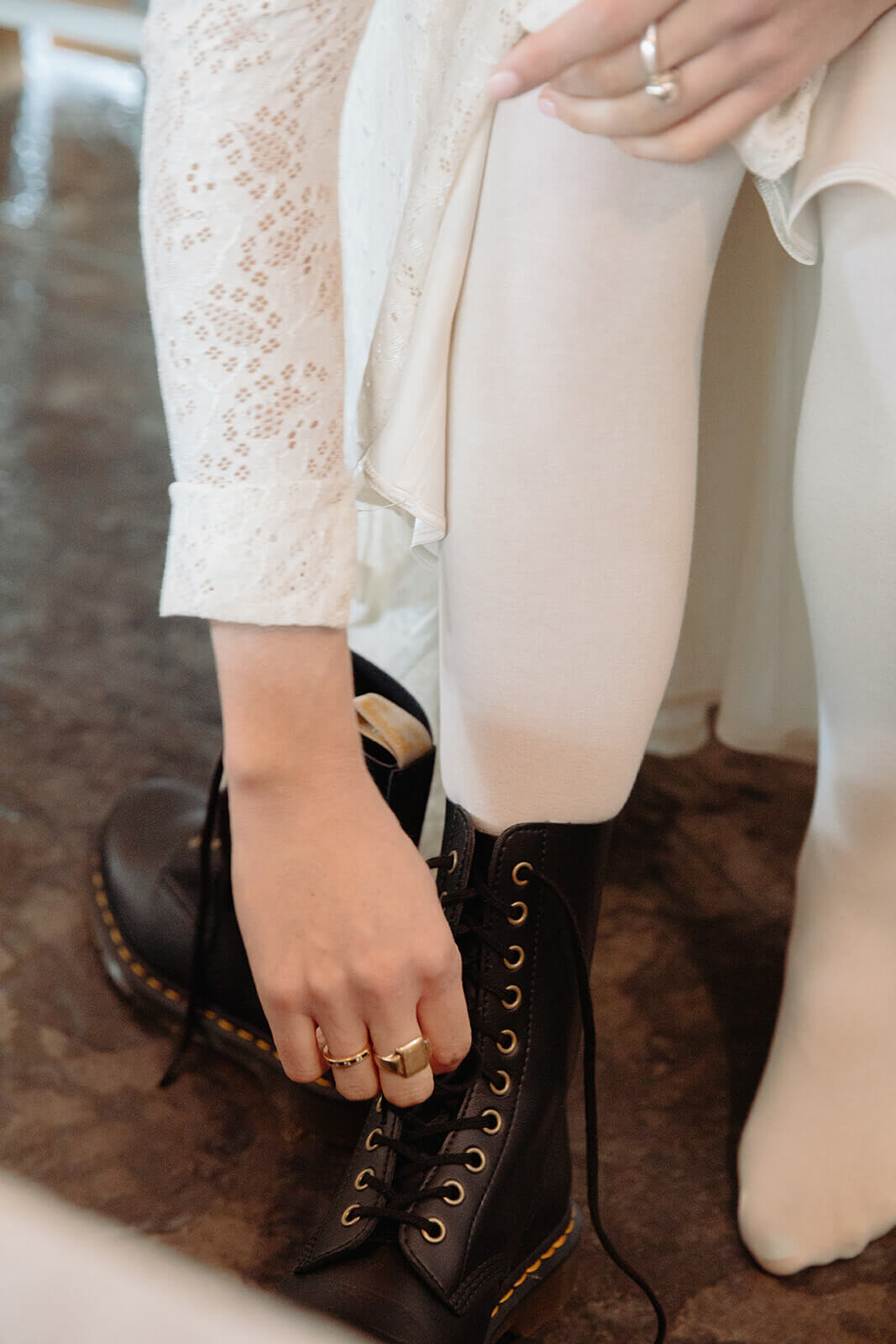  Stylish NYC couple elope late winter in the Finger Lakes region of Upstate NY. Bride puts on hiking shoes 