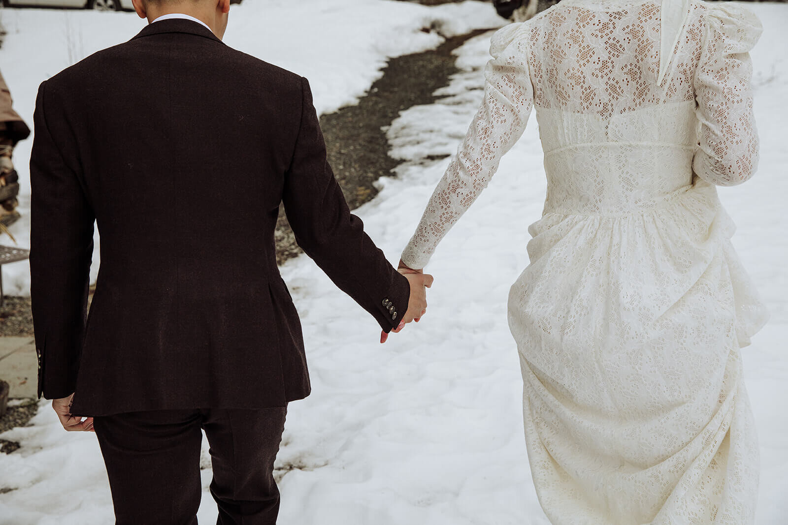  Stylish NYC couple elope late winter in the Finger Lakes region of Upstate NY. Holding hands in the snow 