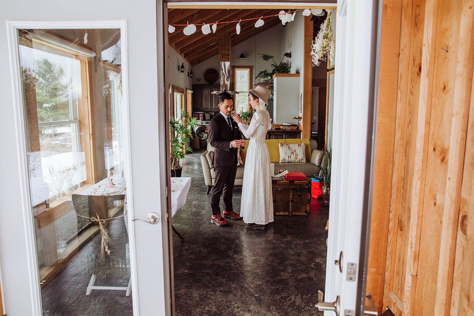  Stylish NYC couple elope late winter in the Finger Lakes region of Upstate NY. Couple gets ready to go 