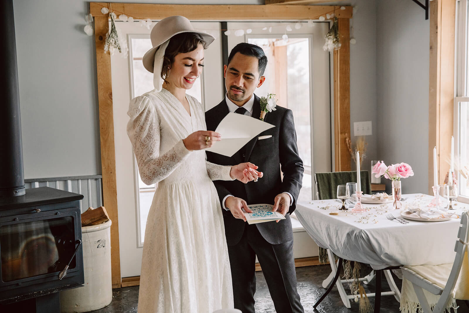  Stylish NYC couple elope late winter in the Finger Lakes region of Upstate NY. Couple reads letters from family. 