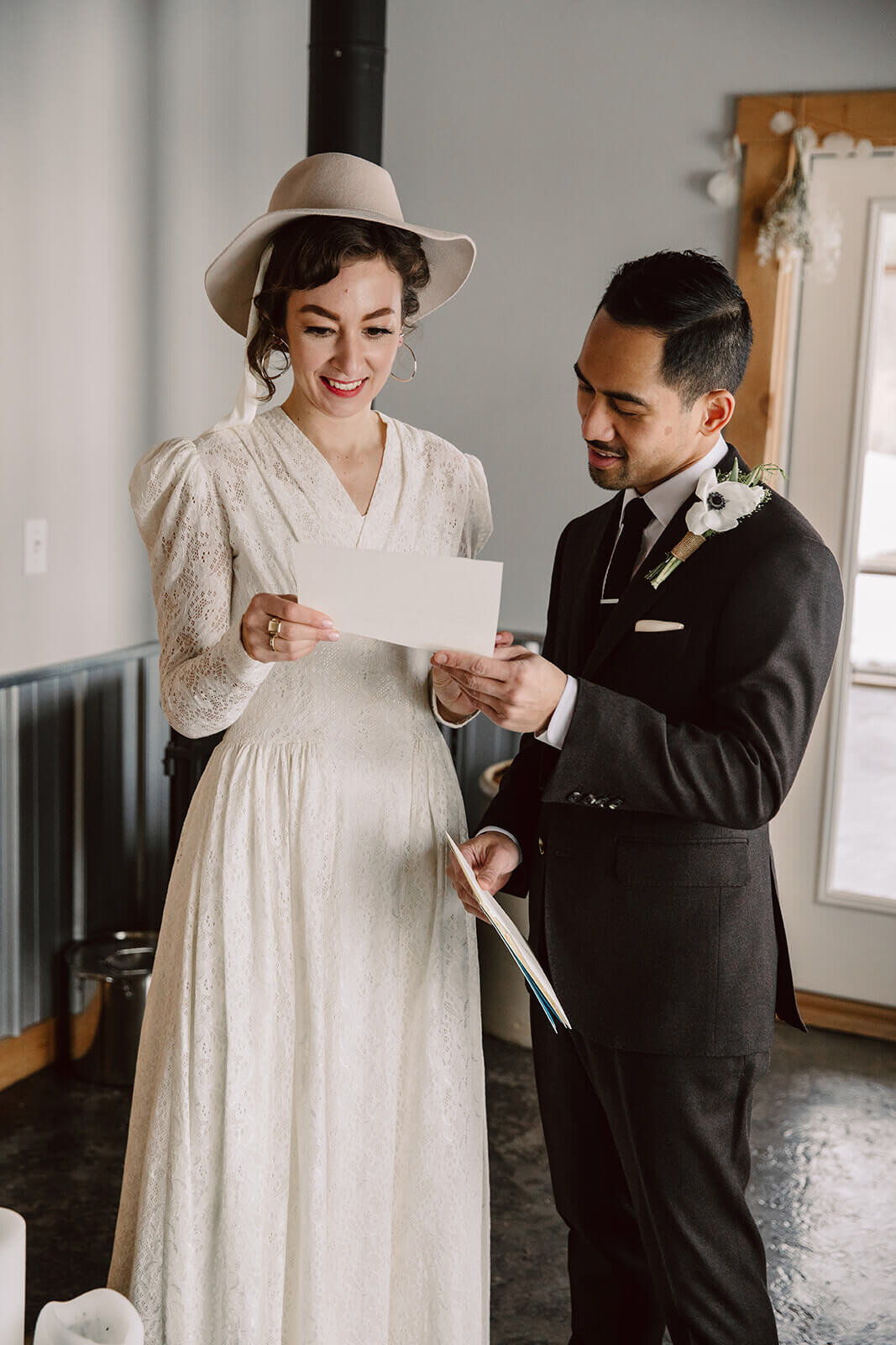  Stylish NYC couple elope late winter in the Finger Lakes region of Upstate NY. Couple reads letters from family 