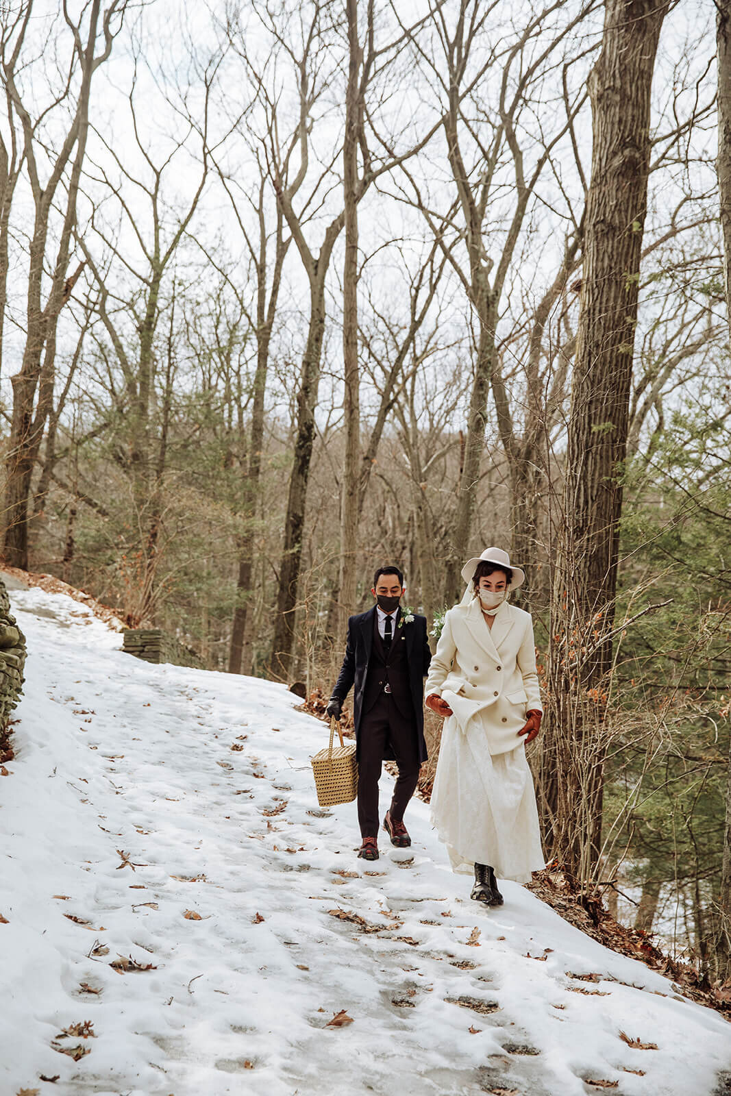  Stylish NYC couple elope late winter in the Finger Lakes region of Upstate NY. Couple hikes to ceremony location in the snow 