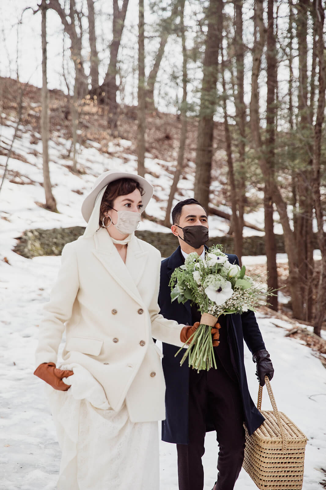  Stylish NYC couple elope late winter in the Finger Lakes region of Upstate NY. Couple hikes to ceremony spot in the snow 