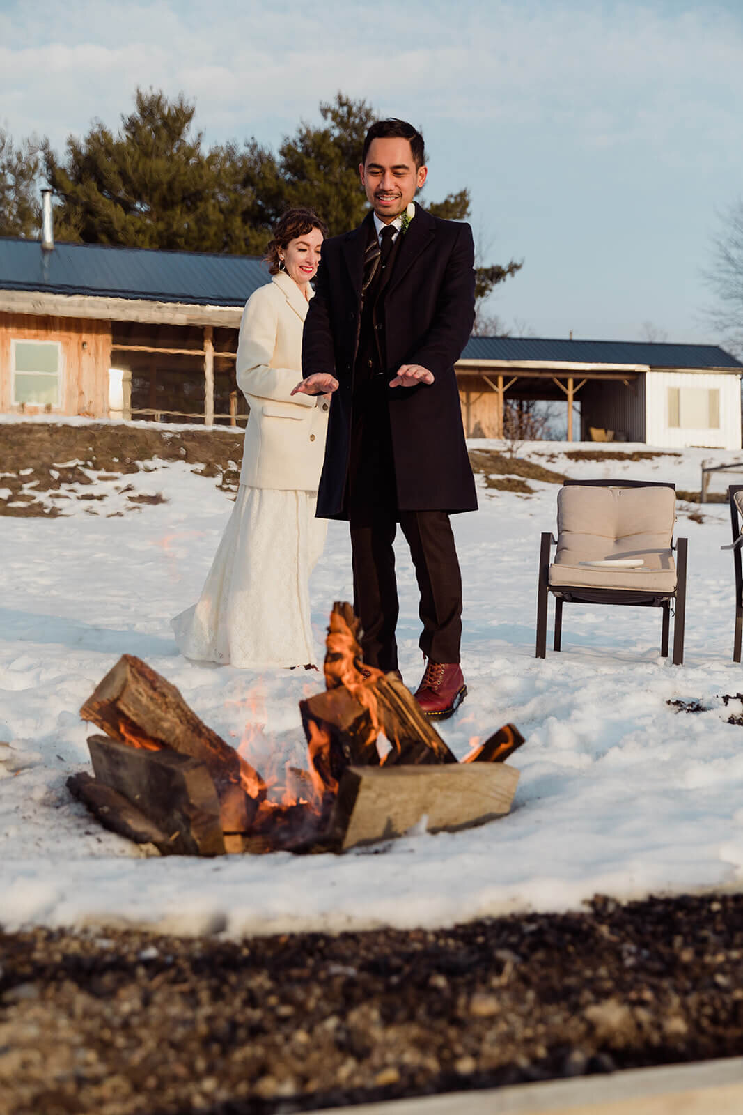  Stylish NYC couple elope late winter in the Finger Lakes region of Upstate NY.  Campfire at the cabin 