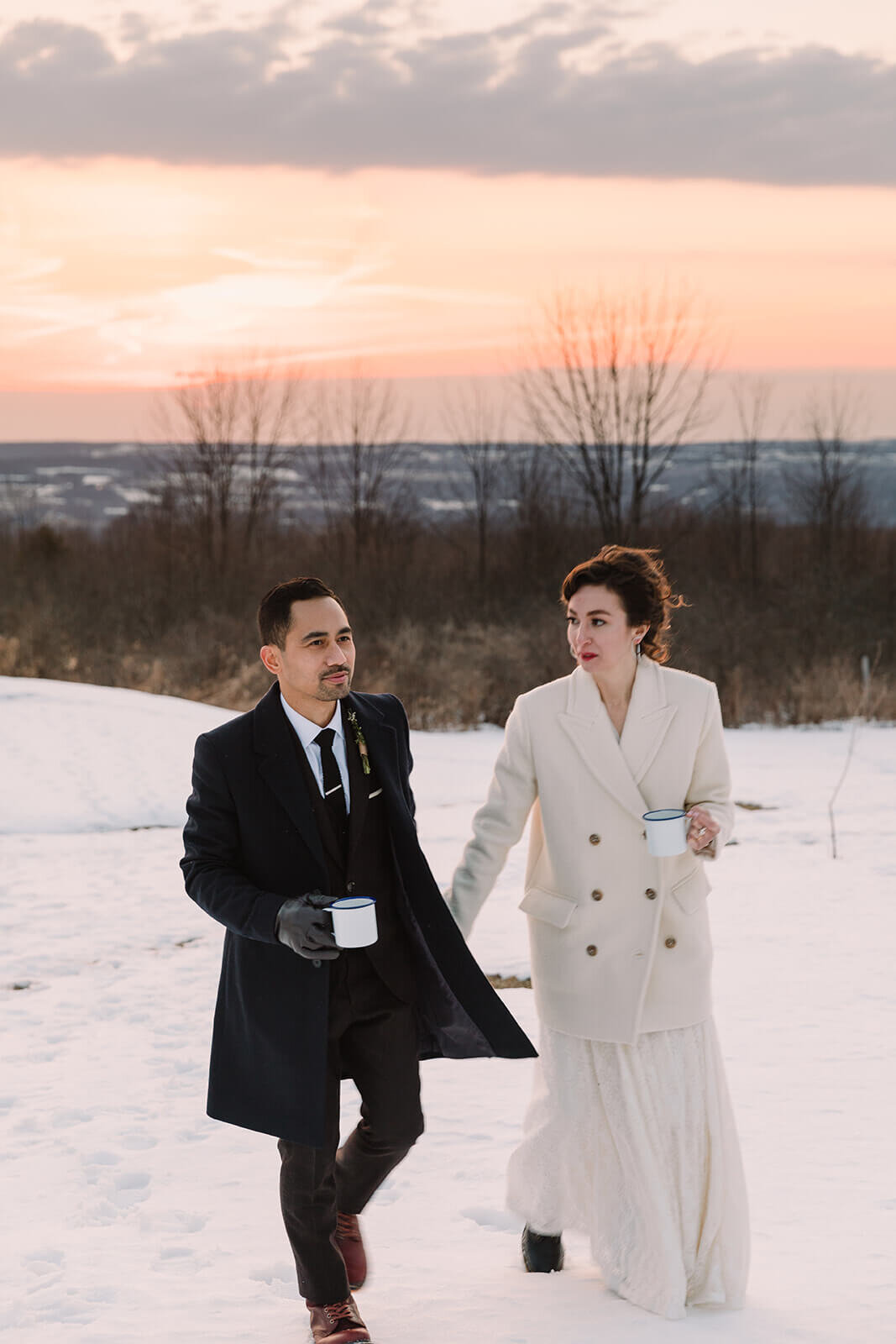  Stylish NYC couple elope late winter in the Finger Lakes region of Upstate NY.  Drinks by the campfire during sunset 