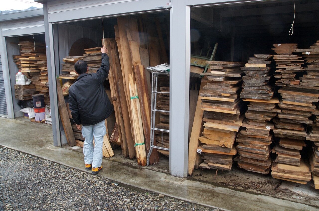  This is the lumber stockpile of the bathtub craftsman Douglas mentioned who apprenticed with a boatbuilder and then waited thirty years for his chance to finally build boats. Photo Credit: Douglas Brooks. 