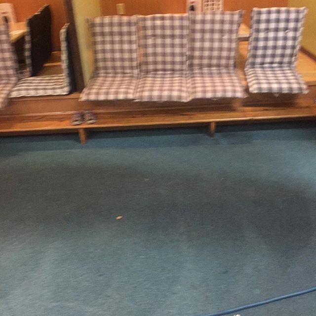 Dirty black traffic lanes in restaurant Carpet coming all the way out and looking great.