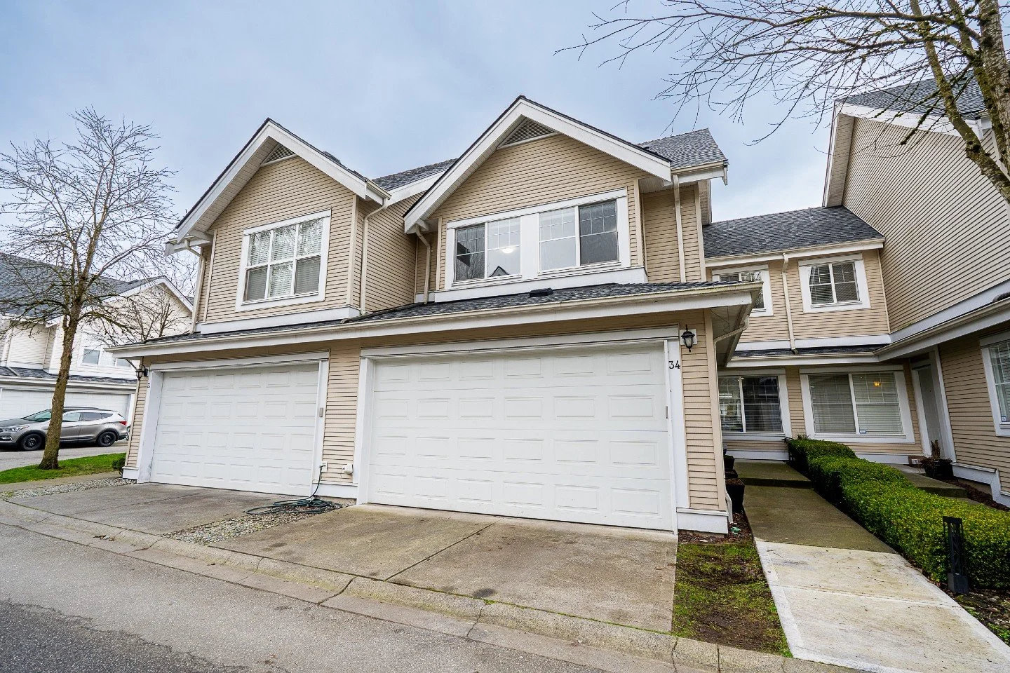 2,300 sq.ft. on 2 levels for $389/sq.ft. AND with AC? That's living at the Kentucky Complex:

Unit 34 - 17097 64 Avenue, Surrey

This bright and spacious 2,314 sq ft townhome offers 3 bedrooms up, 1 down, and 2.5 bathrooms with convenient grade-level