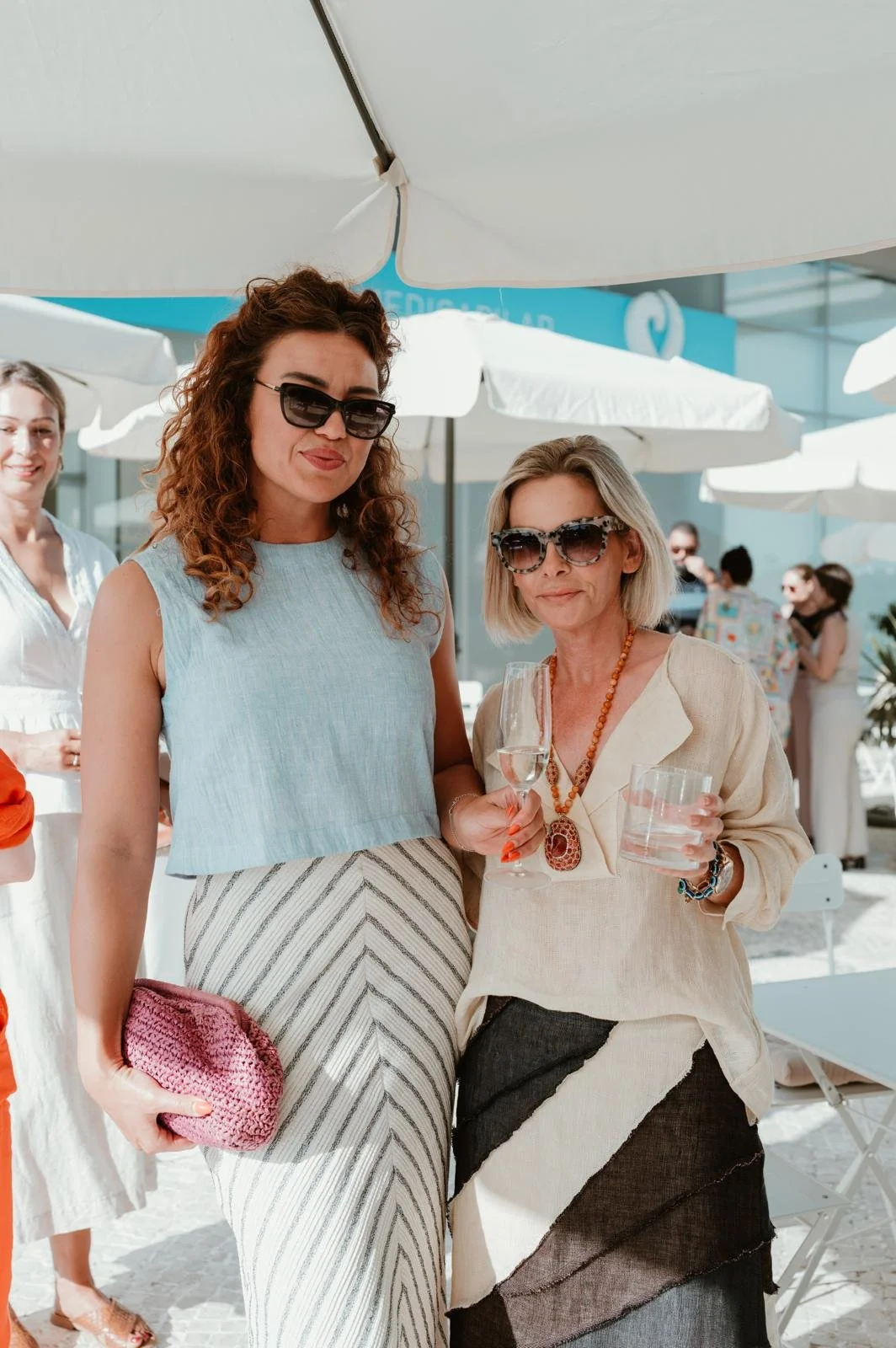 sarah nicollier with client summer party vilamoura office algarve portugal