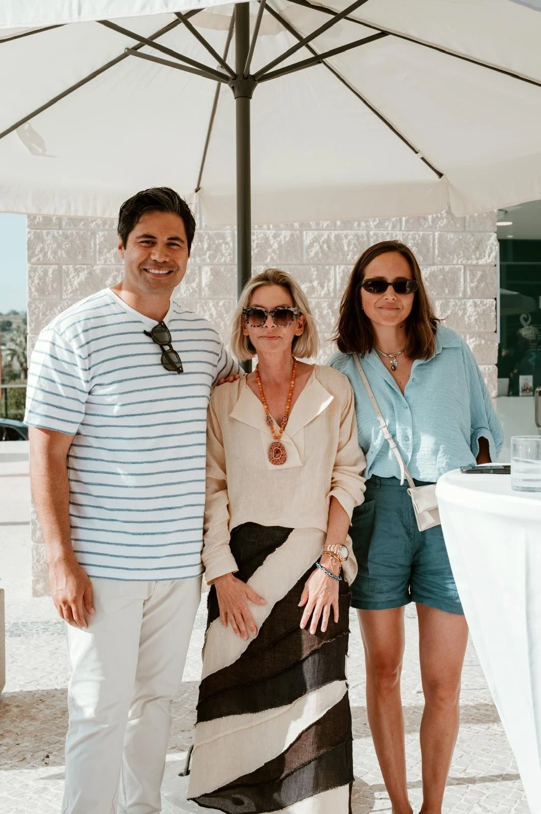 sarah nicollier with clients at summer party vilamoura office algarve portugal