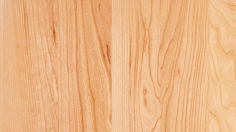 CHERRY Cherry’s natural color, while stunning from the beginning, continues to enrich as time passes and is most apparent in clear or light stain finishes. Cherry is a multi-colored wood characterized by shades of red, white and brown. With time, darker tones will turn a deep reddish brown, while light areas will mellow to medium yellow and brown.