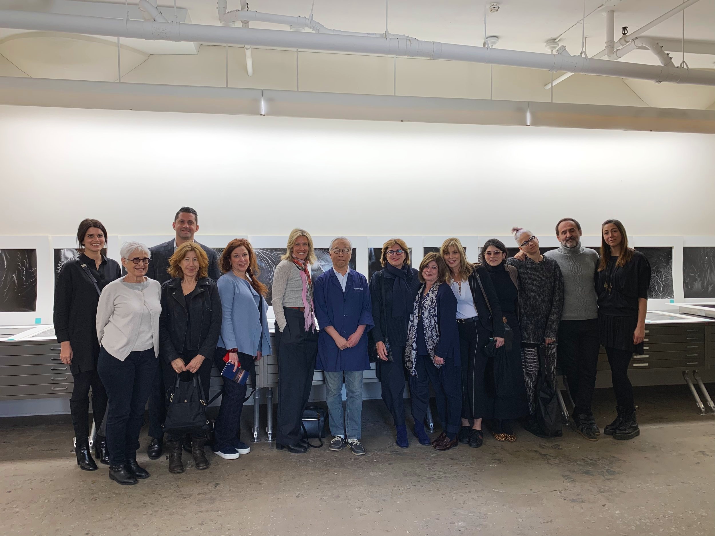 FEBRUARY 2019 VISIT TO HIROSHI SUGIMOTO’S STUDIO. Pictured from Left to Right: Hilary Goldsmith, Barbara Toll, Leon BenRimon, Nicole Klagsbrun, Shari Popkin, Gail Perl, Hiroshi Sugimoto, Rivka Saker, Susan Sanders, JoAnn Shalom, Sarah Lehat, Dana Ben Ari, Nikola Duravcevic and Lauren Silbert Sosnoff.
