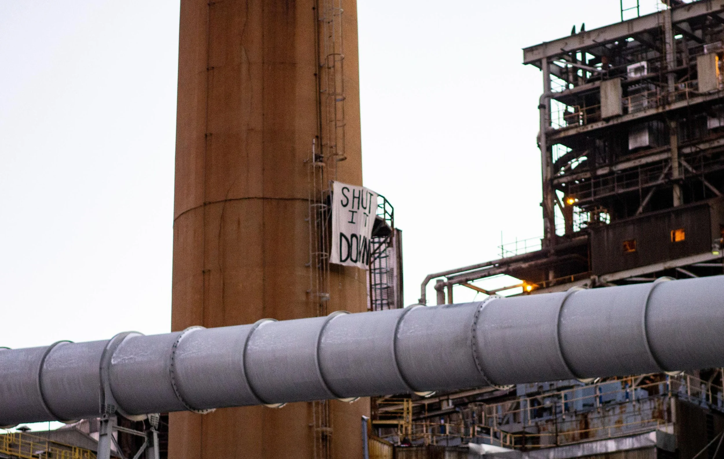 Activists scale smokestack at NH coal plant and Release "Shut It Down" Banner