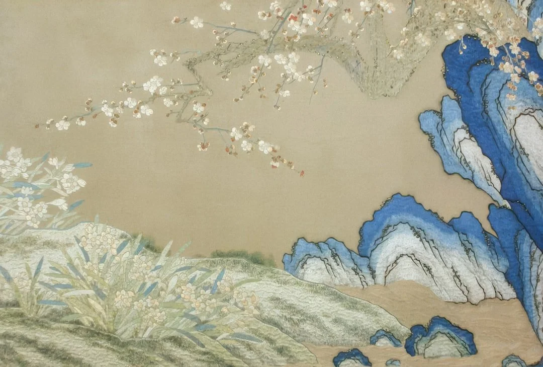 Traditional Chinese painting of rocks and flowering branches in a tranquil natural setting reflecting Daoist principle of living in harmony with the Dao .