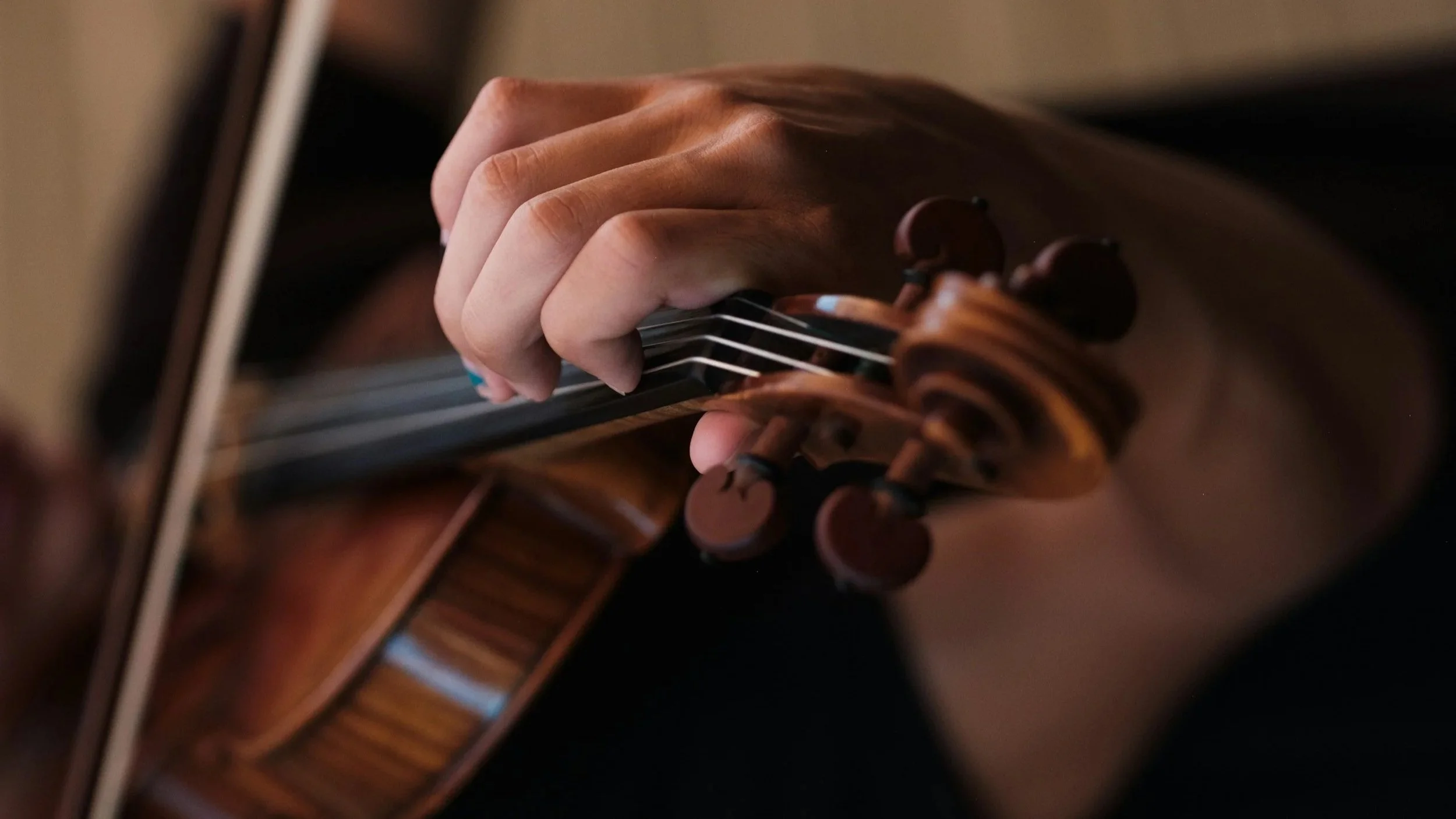 Tuning a violin.