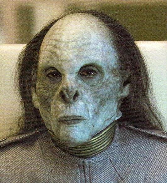  This makeup of Ambassador Choku was applied by Scott Wheeler and myself. The sculpture was done by Glen Eisner at AFX Studios, and lab work by JD Bower. Sorry for the low res quality of the pic, it is a scan from a French magazine.