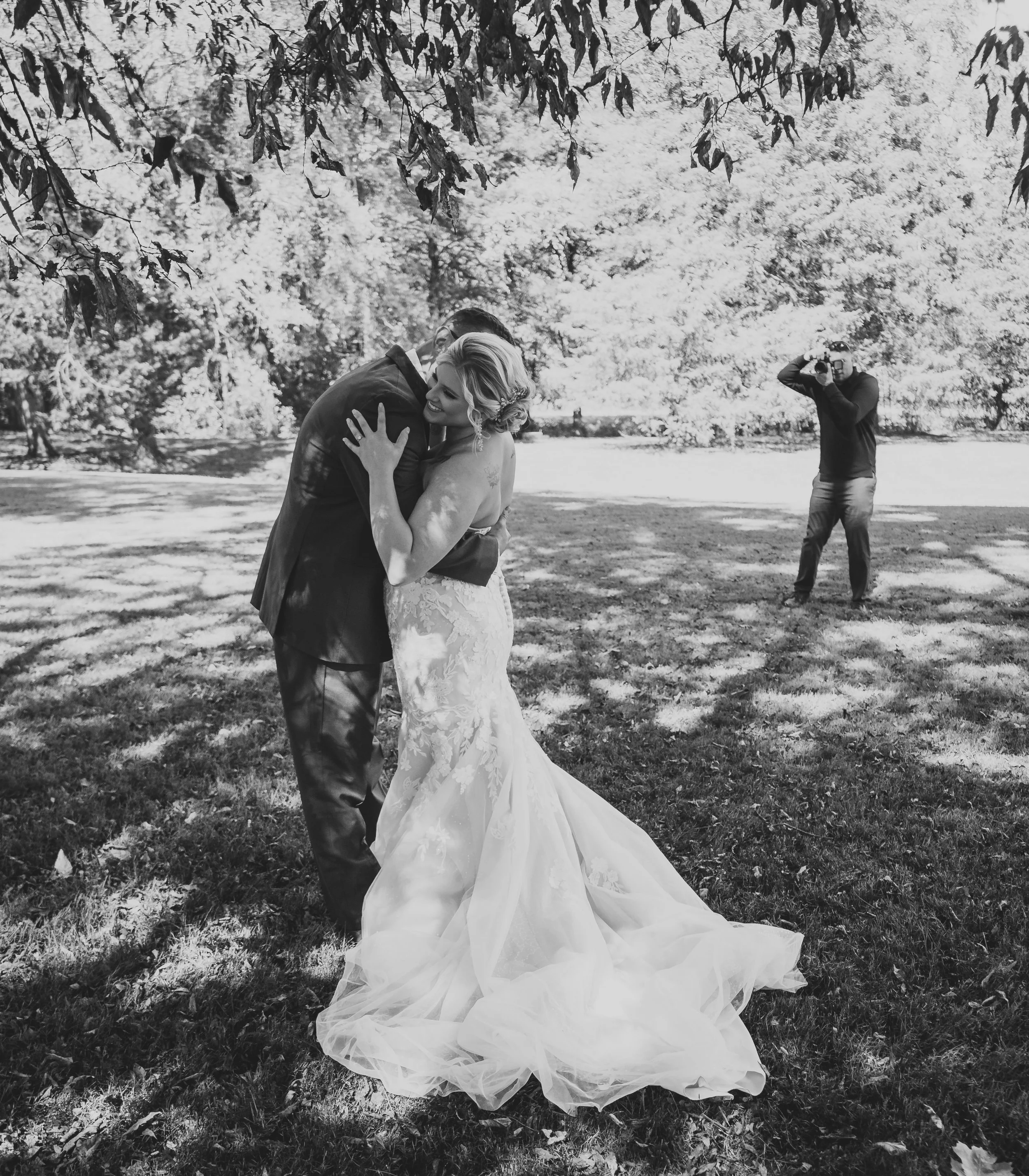 Logan Poff photographing a bride and groom on their wedding day