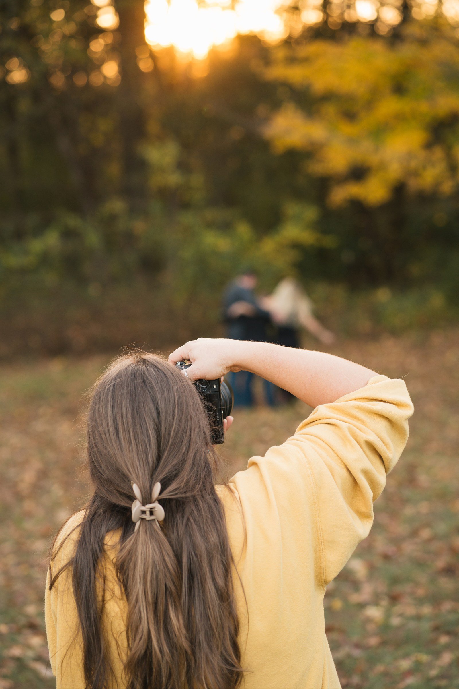 Makayla Poff photographing a couple during a portrait session