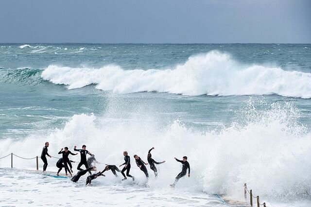 The Chain-Surf Gang :: Teenagers chain-surf at South Curl Curl ocean pool as a large southerly swell hits the Sydney coastline on May 24, 2020 in Sydney, Australia. Winter weather including rain and strong winds is expected to continue through the we