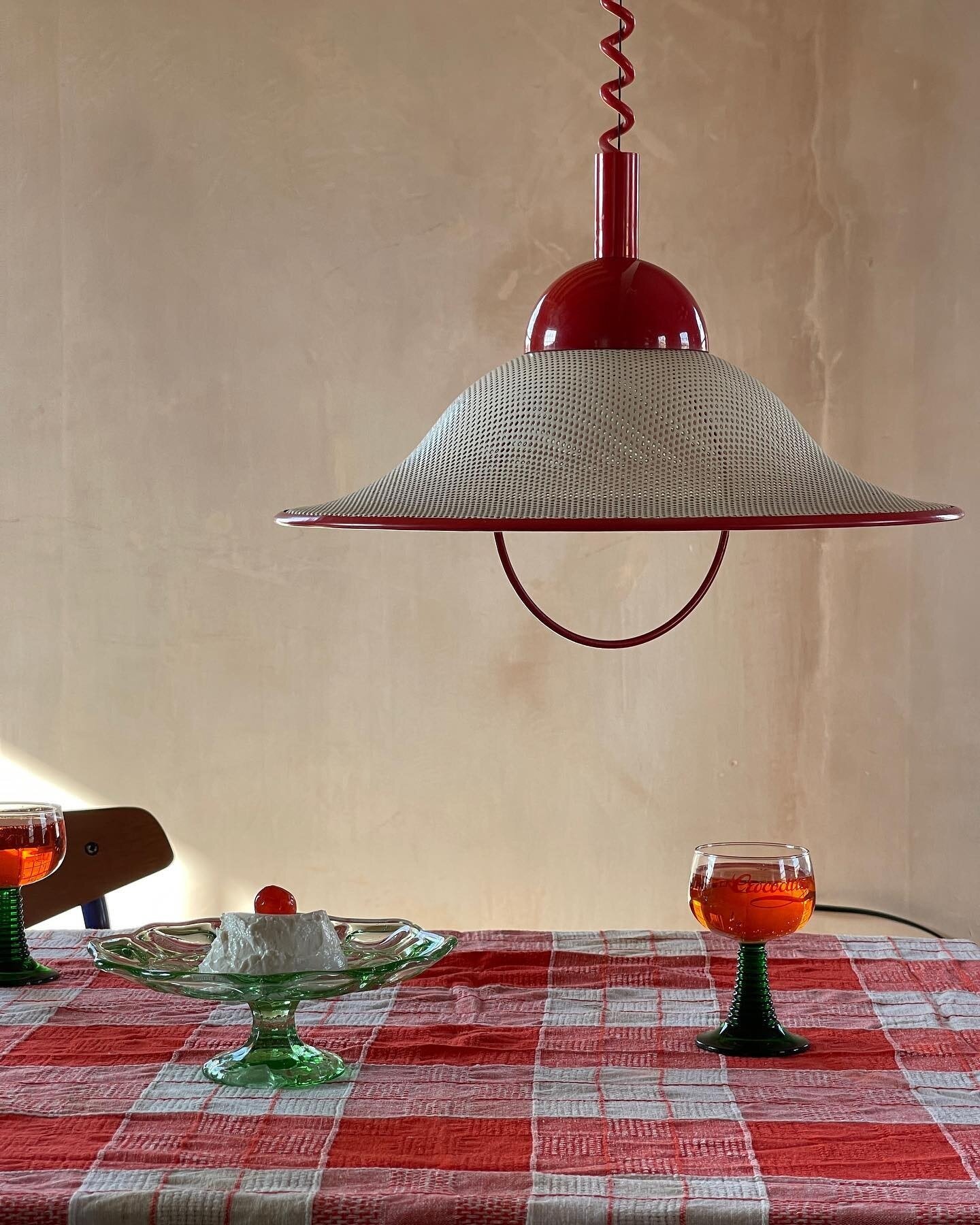 1960s Italian Ceiling Light | &pound;250 SALE PRICE 
Painted perforated metal pendant light with a plastic red cap and coiled wire. The light has a handle so you can pull it to the desired height. 
- Originally from Italy
- Circa 1960s
- Red and whit