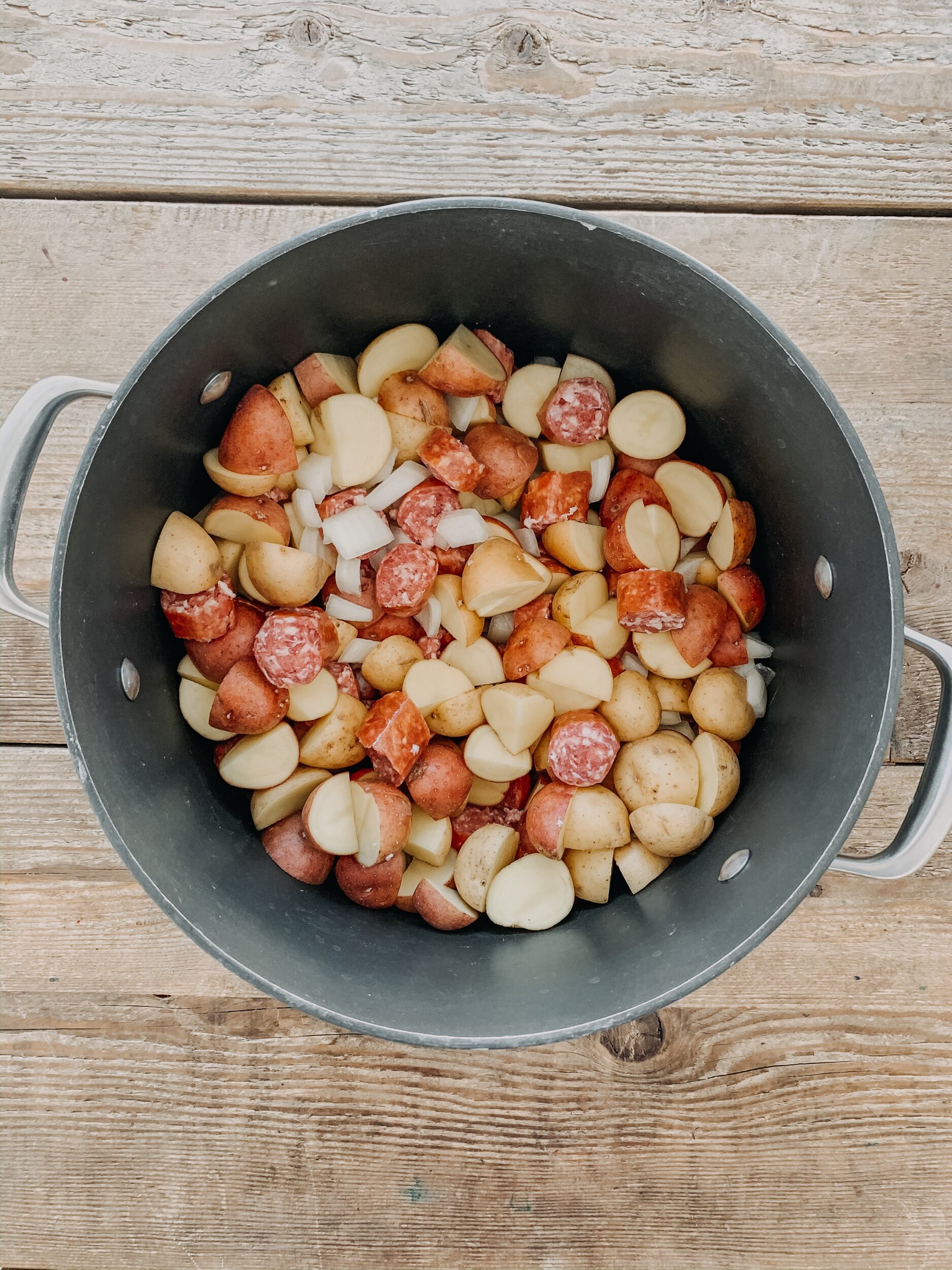 ingredients for mennonite farmer sausage soup in a stock pot