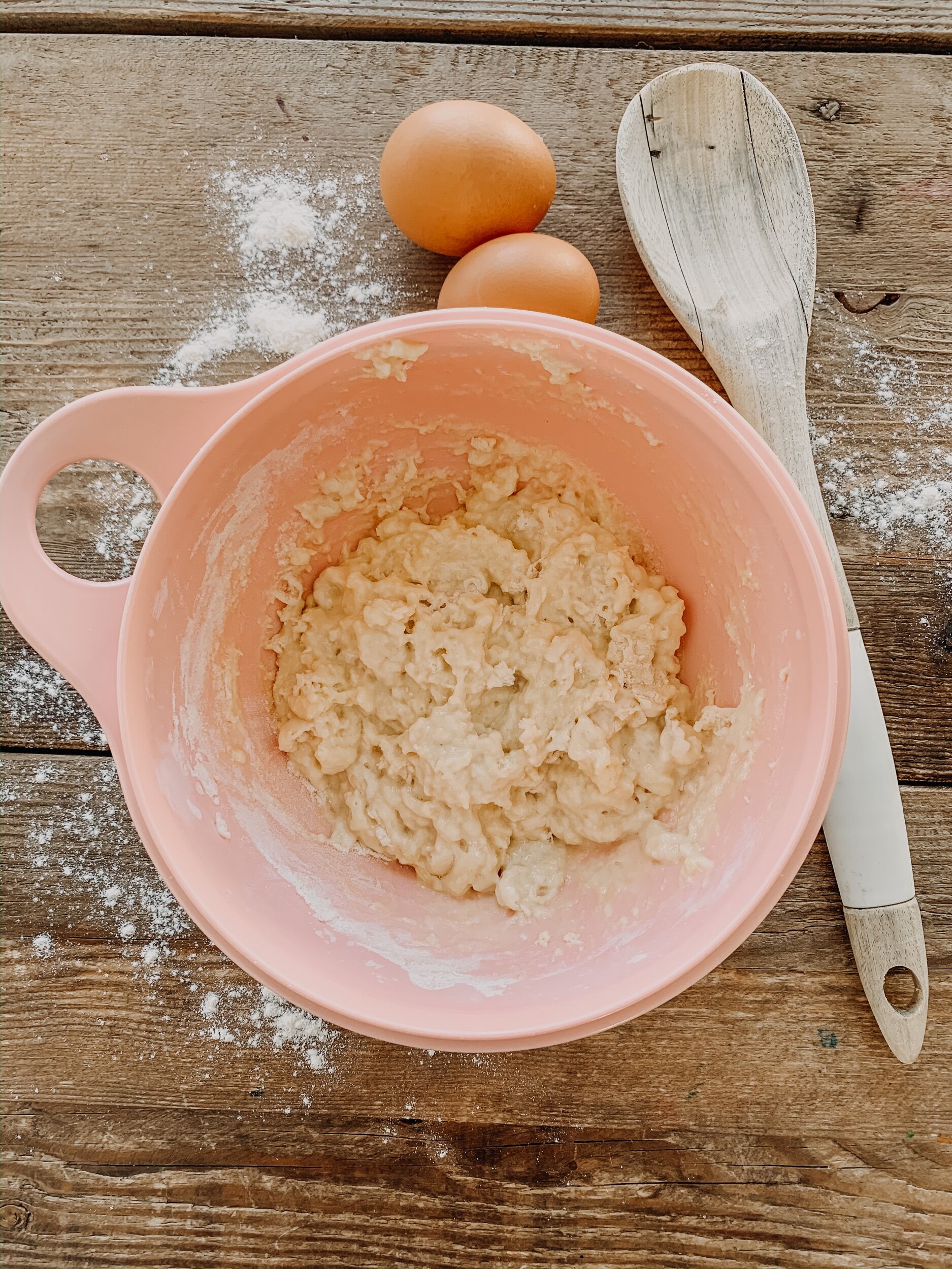 this is a photo of dumplings being made in a pink bowl for mennonite farmer sausage soup