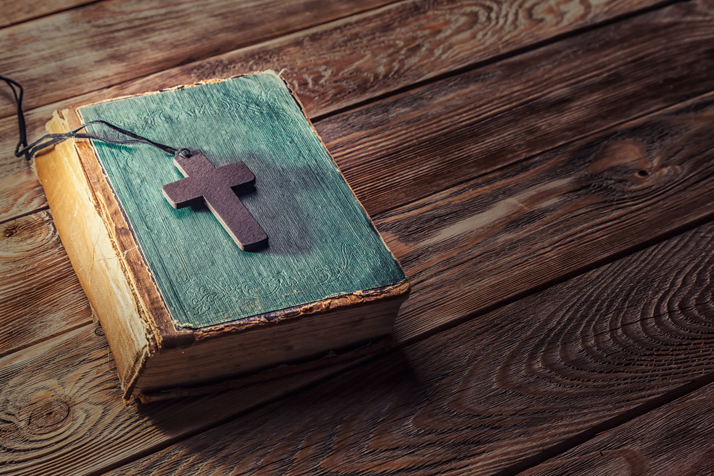 bigstock-Christian-cross-on-bible-105120932.jpg