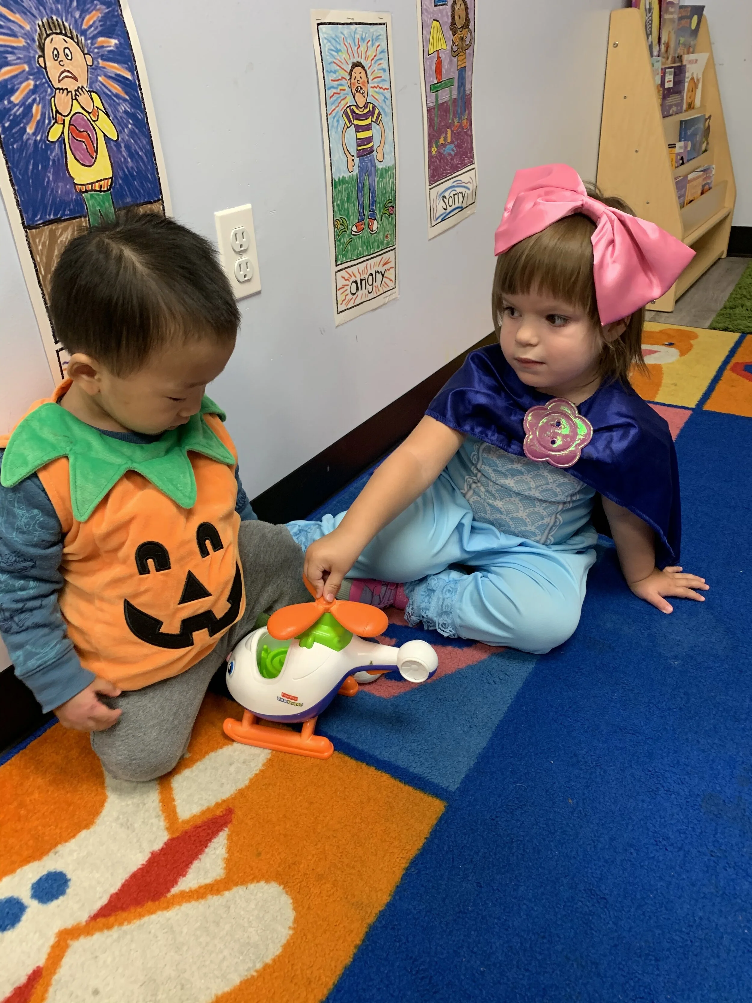 Two kids in their Halloween costumes 