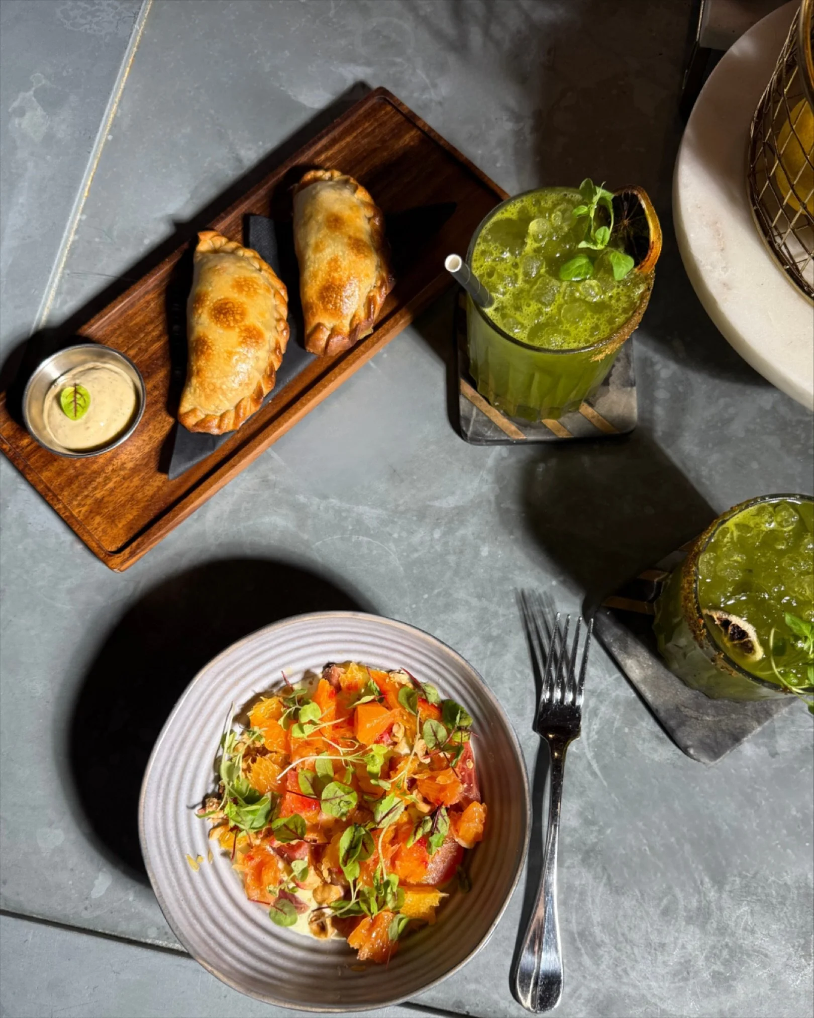Chicken Pesto Empanadas anyone?
These Golden empanadas are filled with house-made pesto, melted mozzarella & confit tomatoes, served with a chipotle tarragon aïoli.  Balance it with a margarita, or two, and our new Citrus Beet salad with be