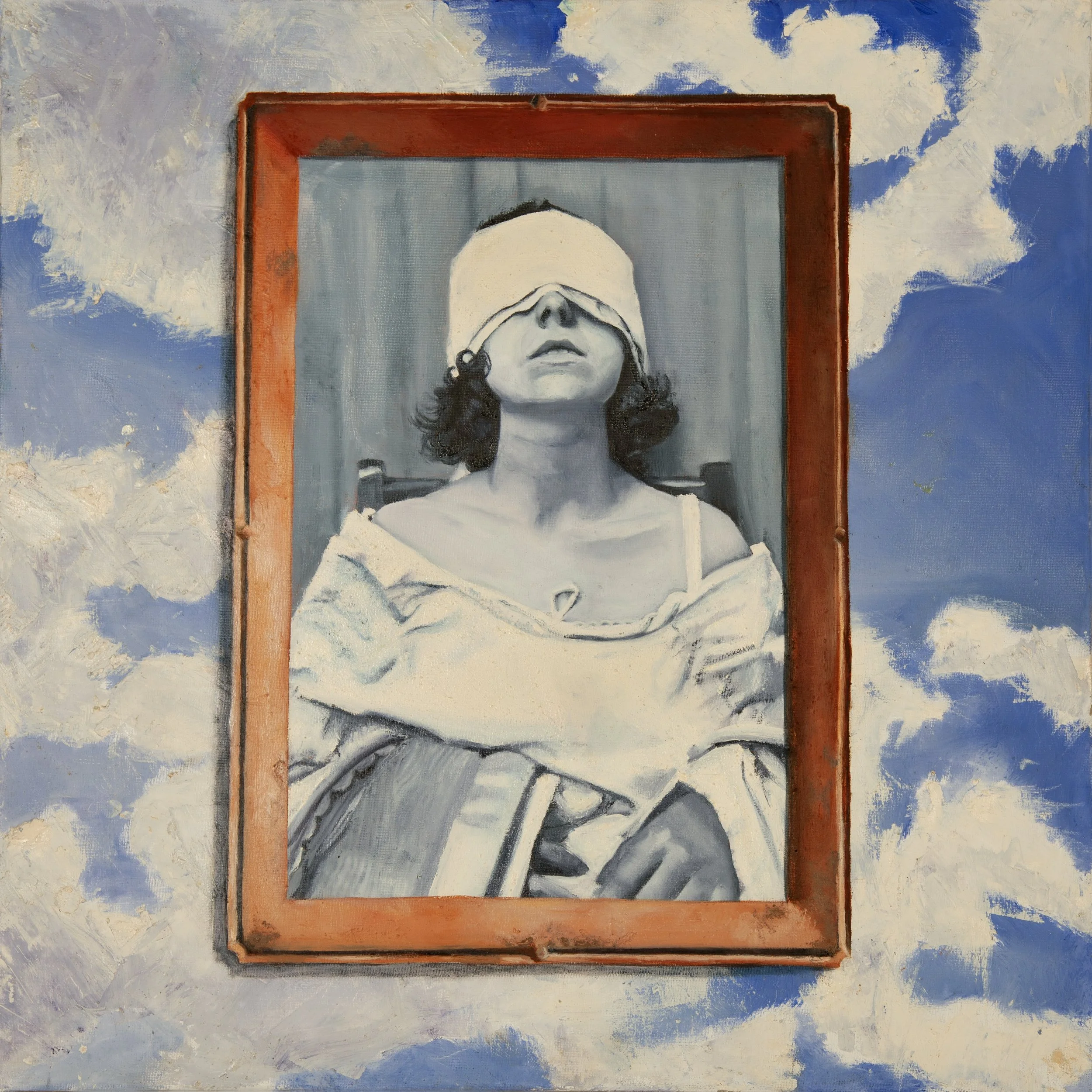 A blindfolded woman sits in a chair, painted in black and white. Her image is surrounded by a copper painted frame hovering in the middle of a cloudy day.