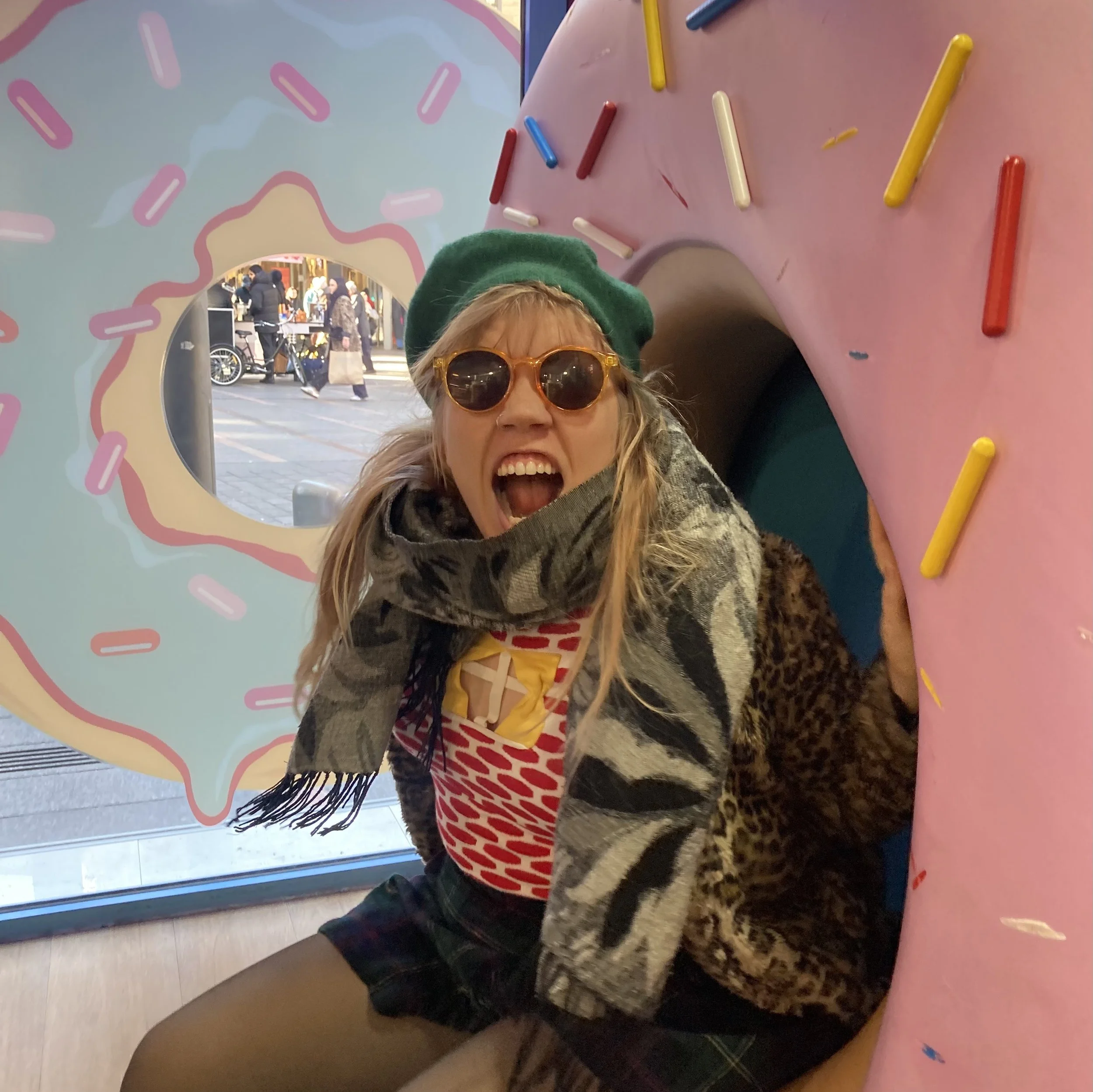 Nikita Andester screaming in a donut shop in Toulouse, France.