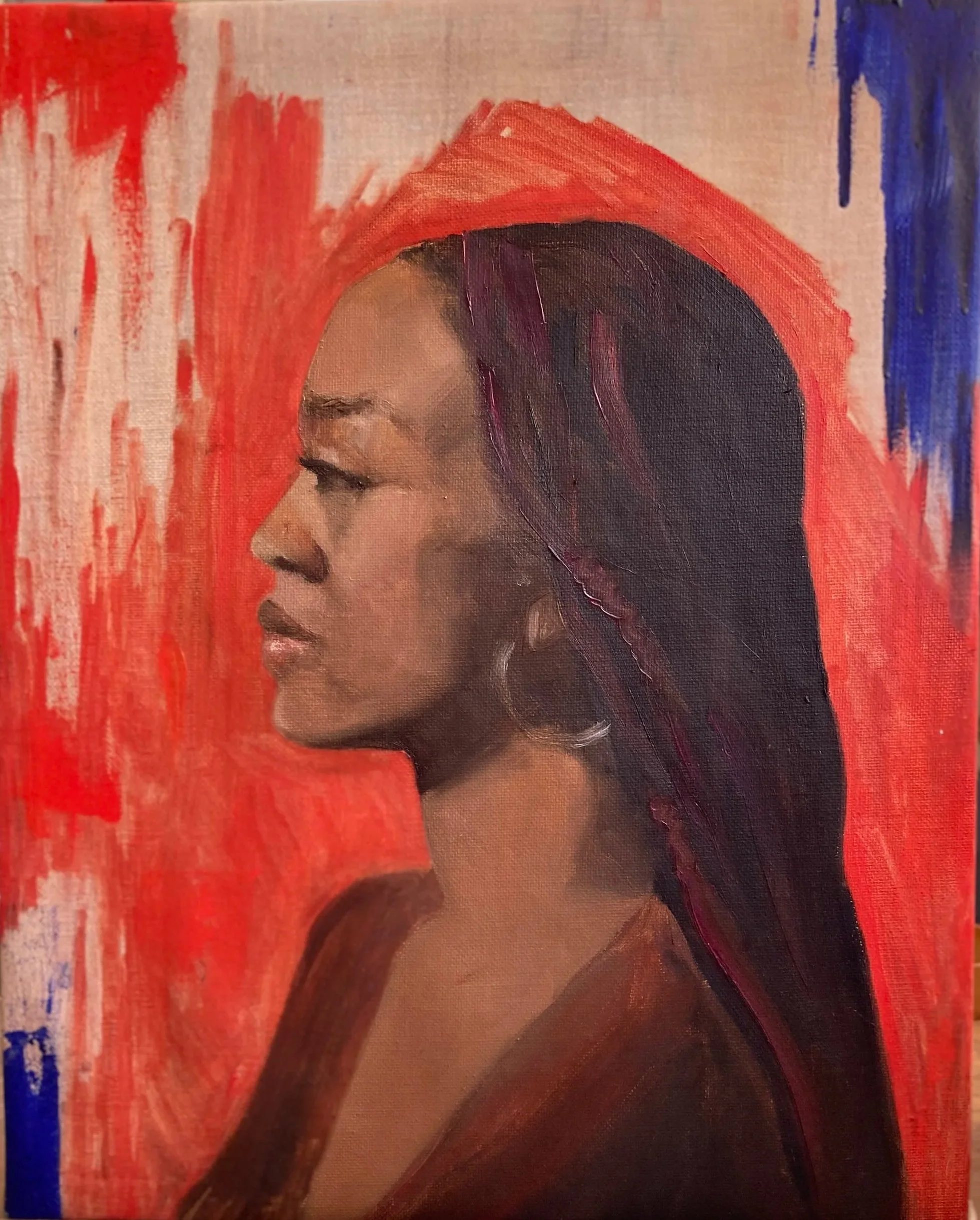 A woman in profile gazes to the left against a burnt orange and ultramarine abstract background. She is black, with a high forehead, long hair with streaks of magenta, and a hint of earrings. She is wearing maroon.