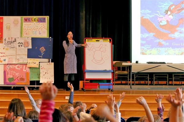 Grace speaking to students on the importance of diverse books.
