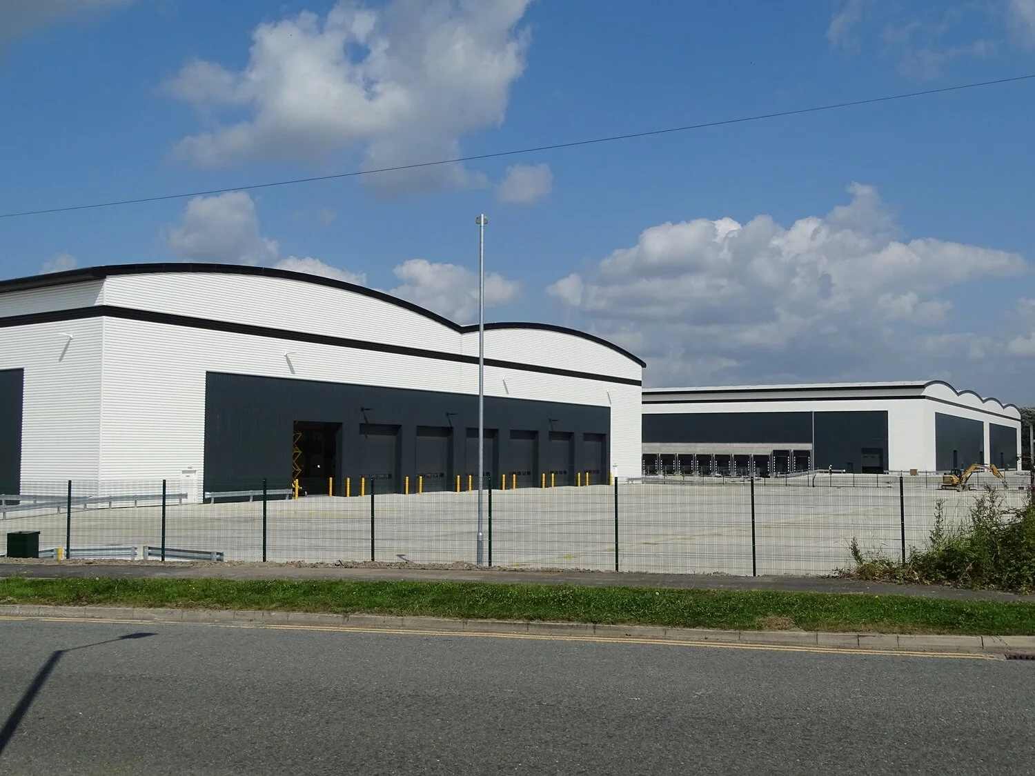 "These two units are on the former Bernstein's site on Wingates Industrial Estate. The smaller one in front is 77,800 sq feet and has been leased to Hermes. The building behind is 282,700 sq feet and has been developed 'speculatively'. It's all chang