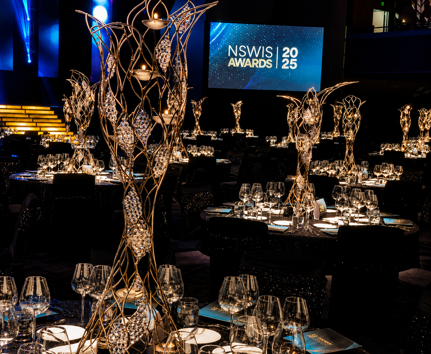 Bespoke gold statement centrepieces for a Sydney corporate awards gala dinner by By Design Event Group